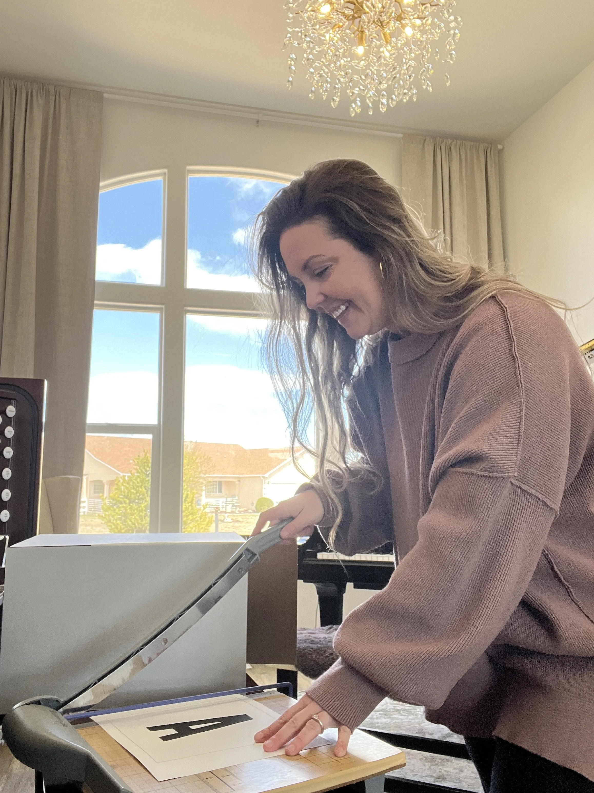 Brittany Brown creating custom music education materials and lesson resources for piano students.