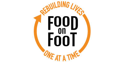 A circular logo with the text 'Rebuilding Lives One At A Time' in orange around the edges of a black circle.