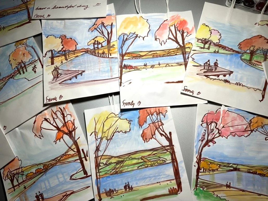Collection of colorful landscape sketches of a lake, trees with fall foliage, and people sitting on a dock, painted with loose ink outlines and watercolors.
