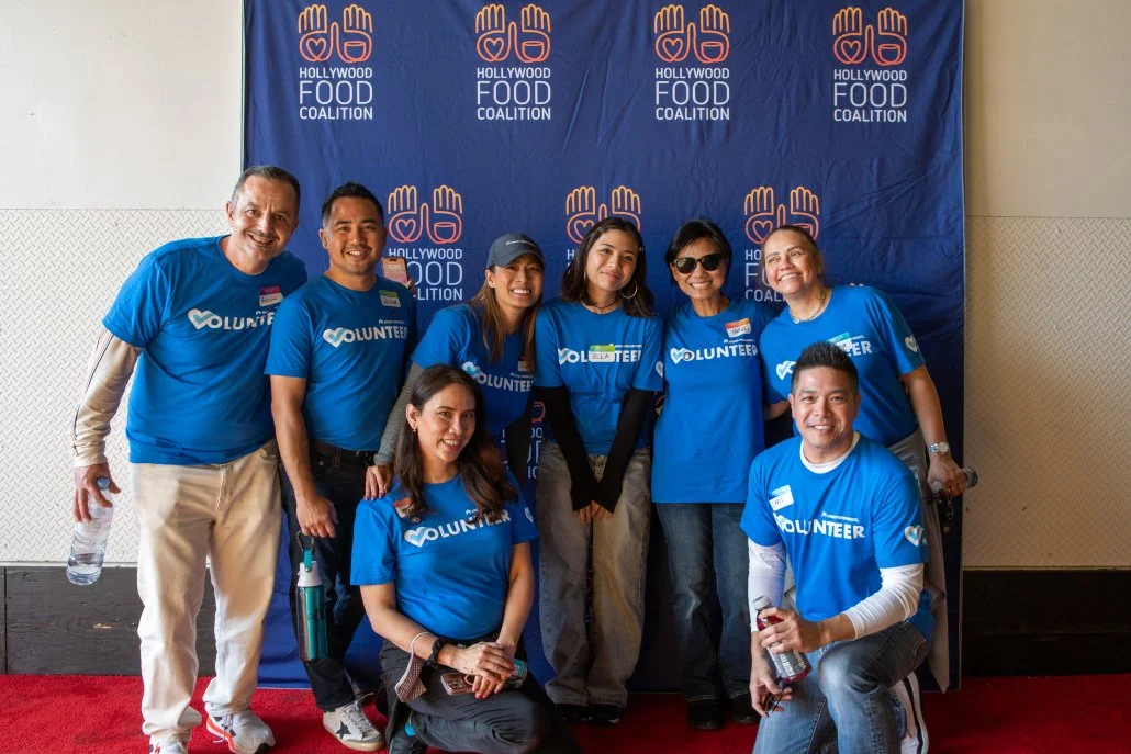 HoFoCo group of volunteers in front of banner