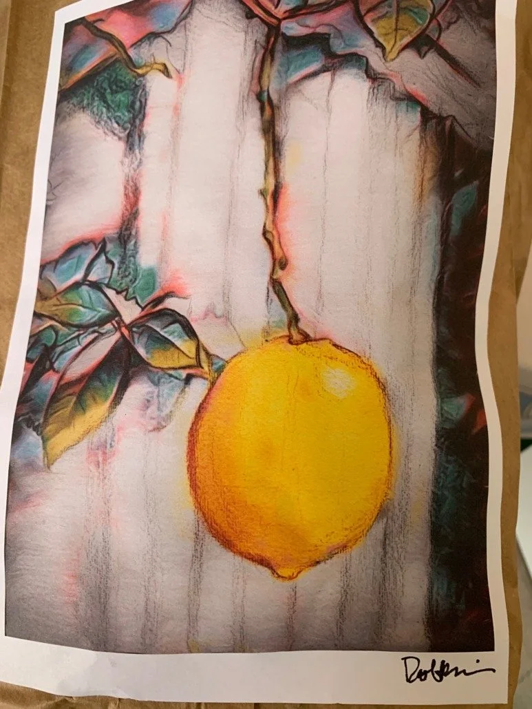 Painting of a yellow lemon hanging from a branch with leaves, against a blurred background