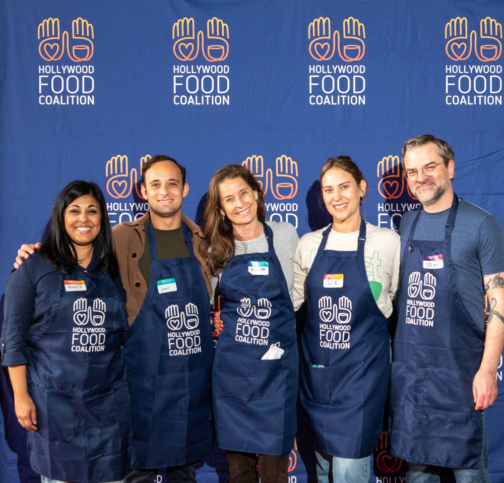 HoFoCo team in front of banner