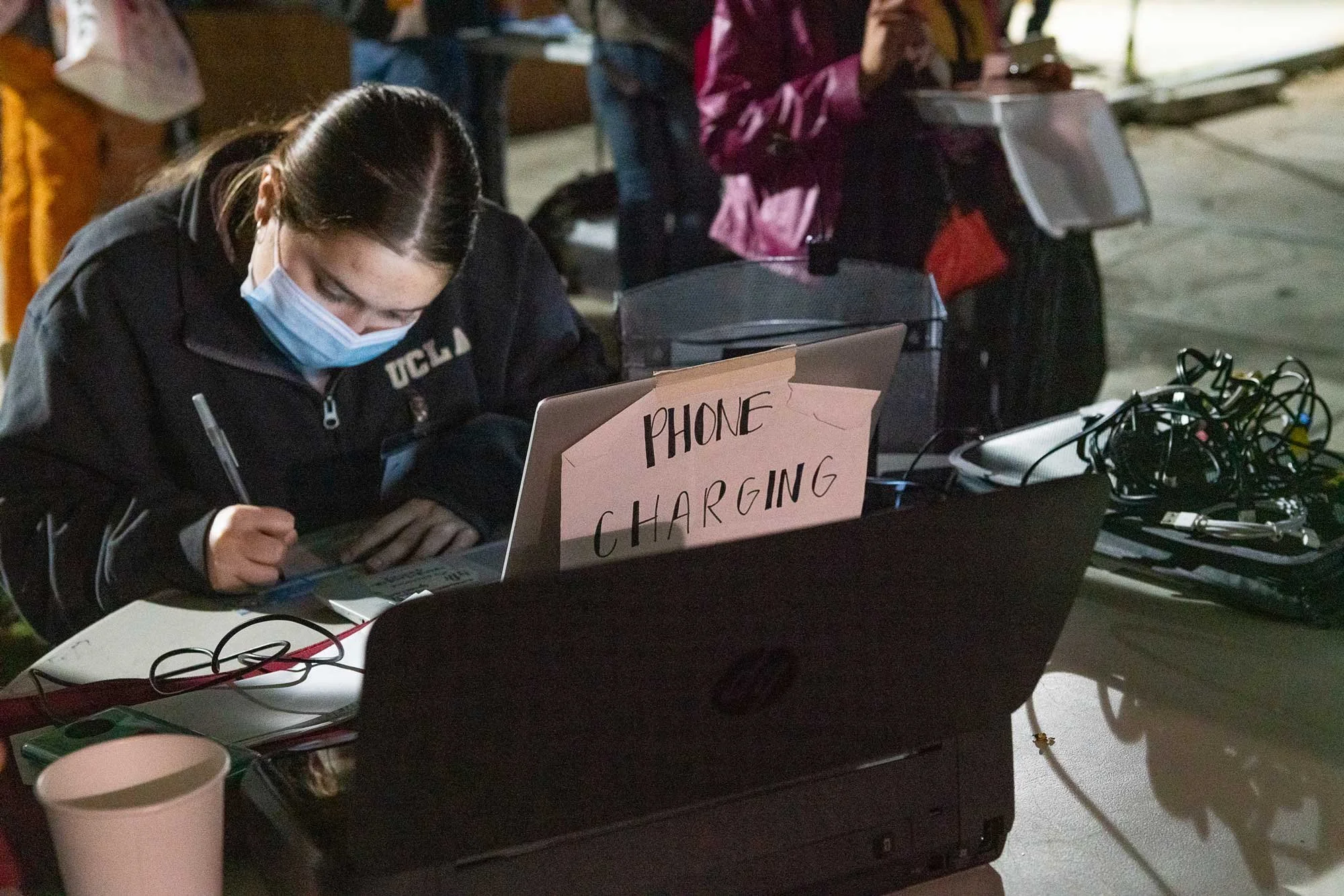 A student studying in phone charging station