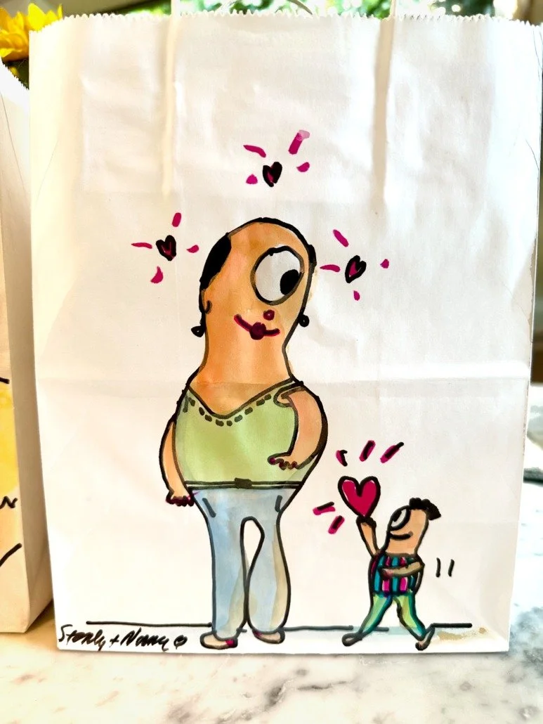 A colorful hand-drawn cartoon of a woman with an oversized head and big eye, smiling with purple lipstick, standing next to a small figure holding a red heart.