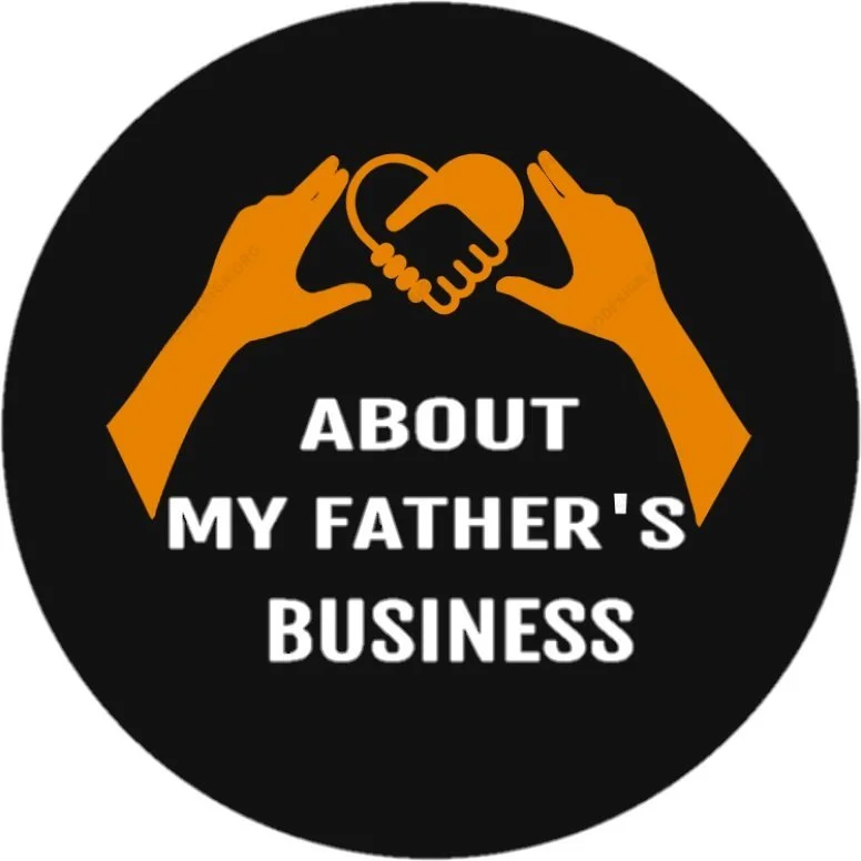 Black circular badge with two orange hands framing a heart-shaped handshake, the text 'About My Father's Business' in white underneath.