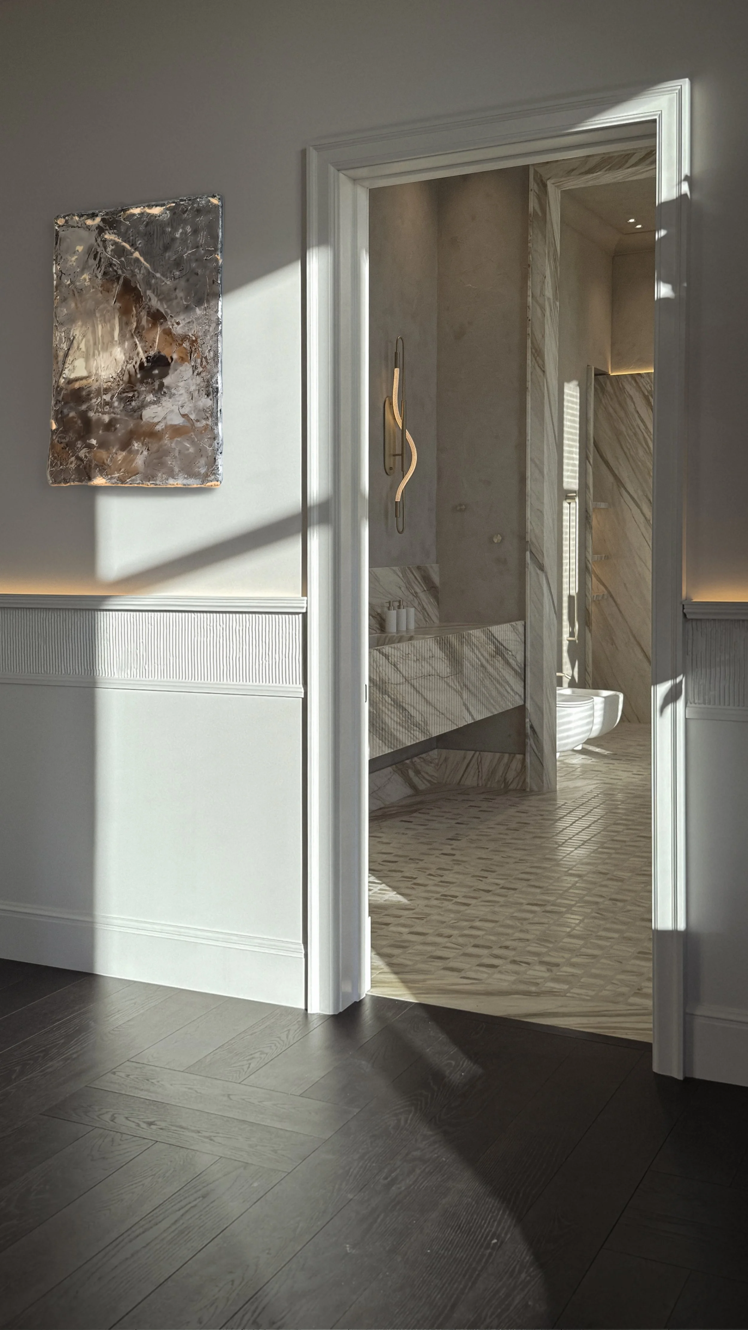 Entrance view into the marble bathroom of Kensington Penthouse by Jenny Ly Studio — natural light highlighting sculptural stone textures and soft-toned walls.