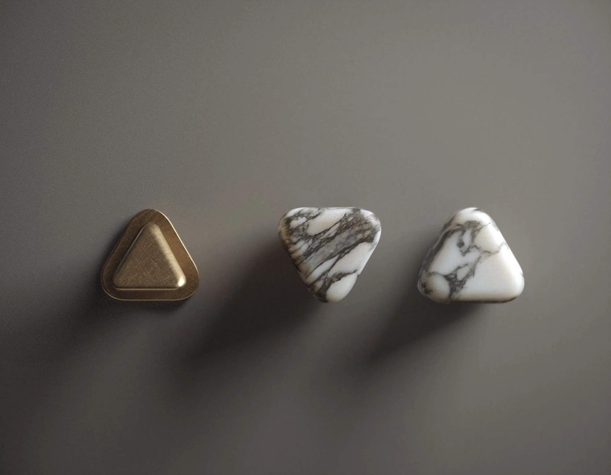 Trinity Collection wall-mounted controls in natural stone and aged metal with soft, tactile triangular forms by Jenny Ly Studio.