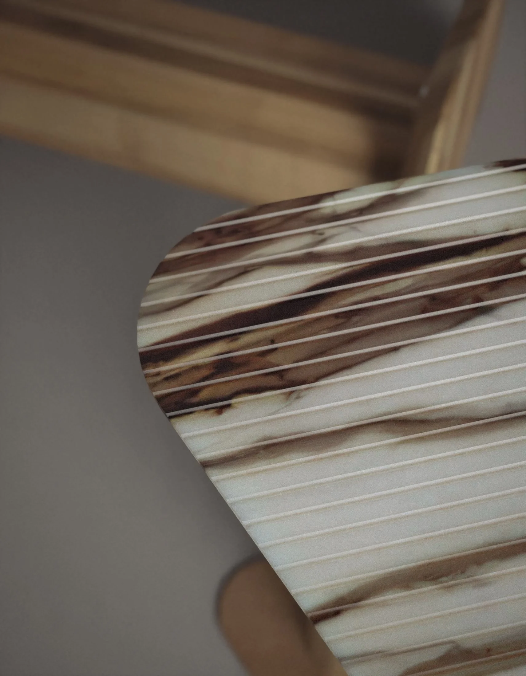 Close-up of milled marble tabletop from the Leaf Collection by Jenny Ly Studio, showing fine veined texture