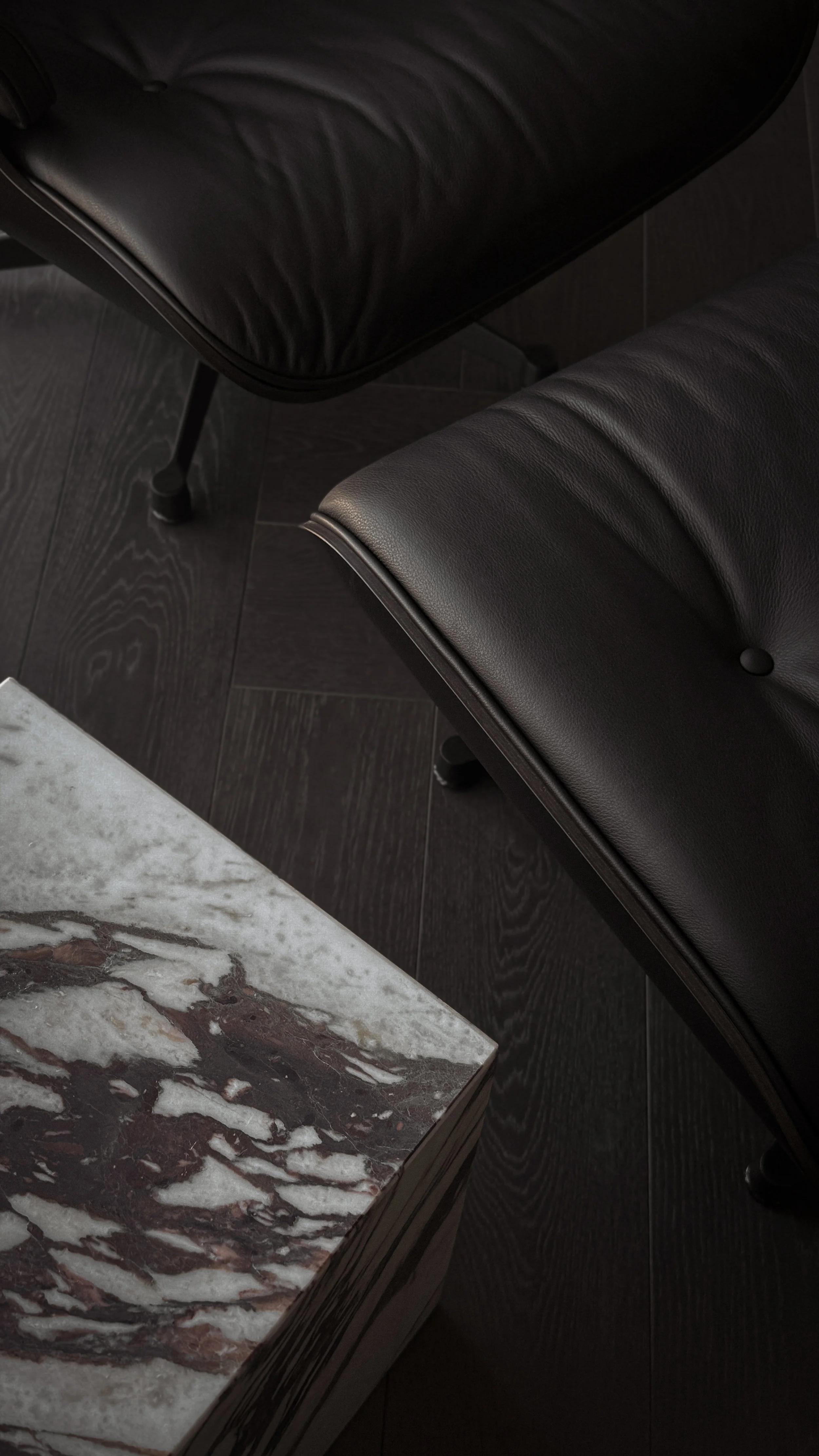 Lounge area interior design in Kensington Penthouse by Jenny Ly Studio — dark timber flooring, leather seating, and Calacatta marble coffee table.