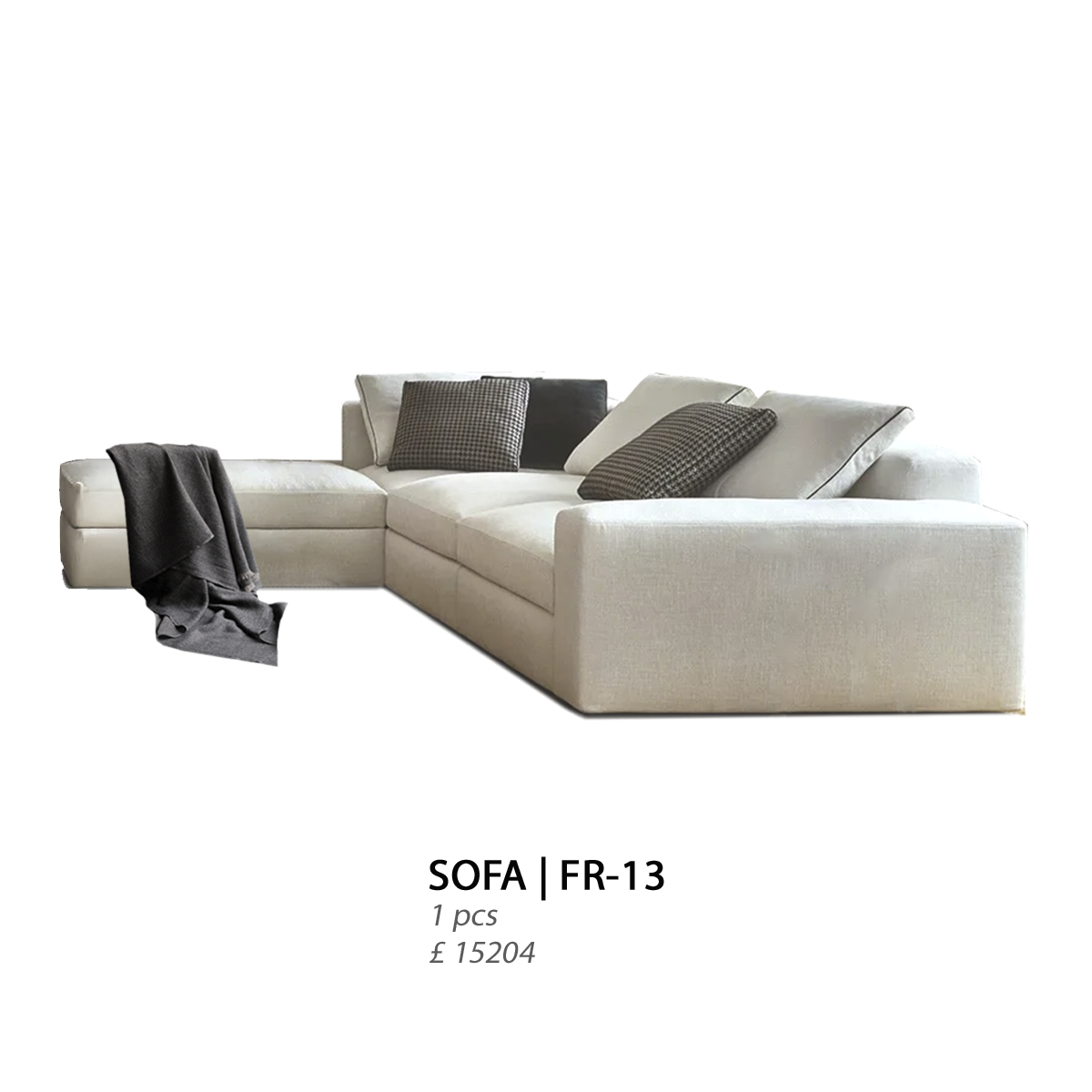 A light-colored sectional sofa with black and patterned throw pillows and a gray throw blanket draped over the left armrest.