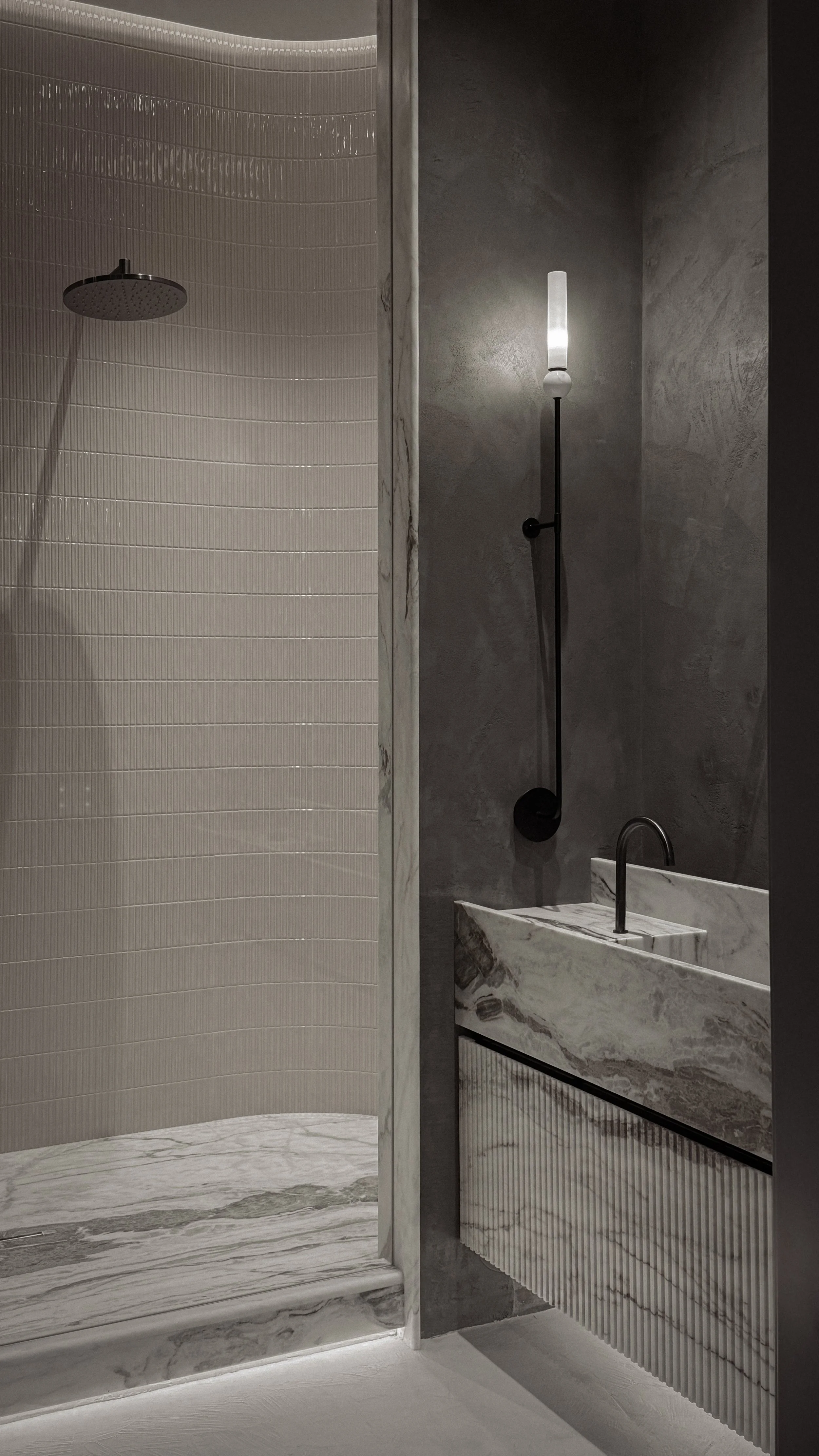 Bathroom interior design in Kensington Penthouse by Jenny Ly Studio — marble sink, textured plaster walls, and ambient lighting.