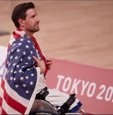 Josh Turek, draped in the American flag at the Tokyo Paralympics