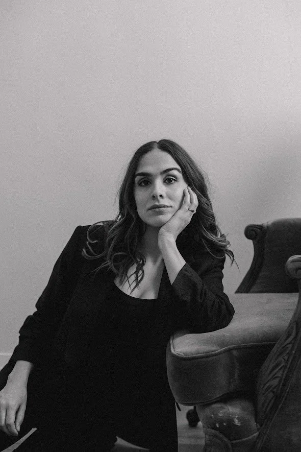 Black and white image, woman, blazer, serious expression