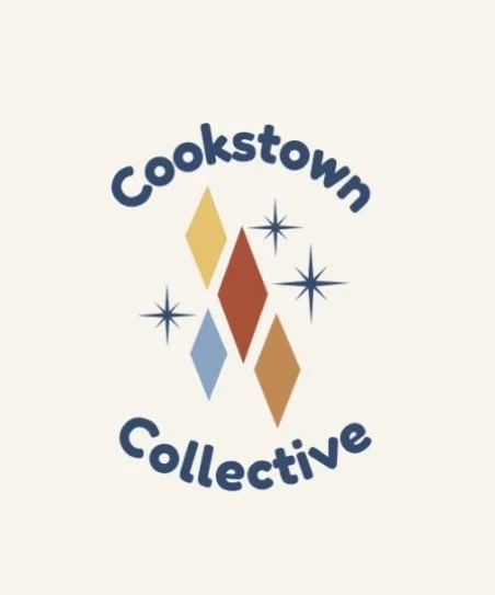 Logo with the text 'Cookstown Collective' surrounding multicolored diamond shapes and starbursts.