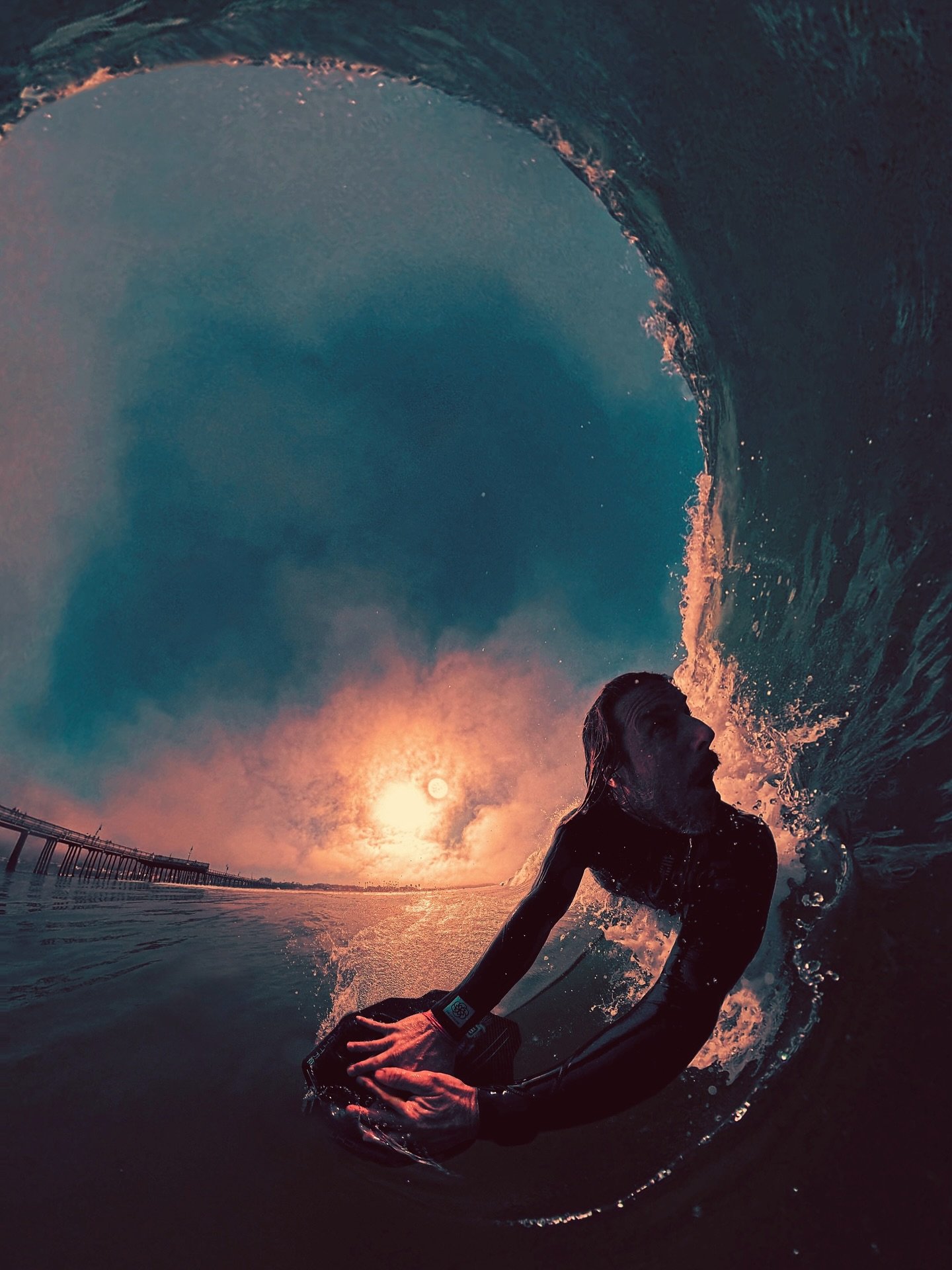 Check out the sun!!! I loved how this image turned out. The light was trying to shine through the morning clouds, and allowed the camera to see the actual shape of the sun, plus the way the light reflected off the white water to frame me, was super c