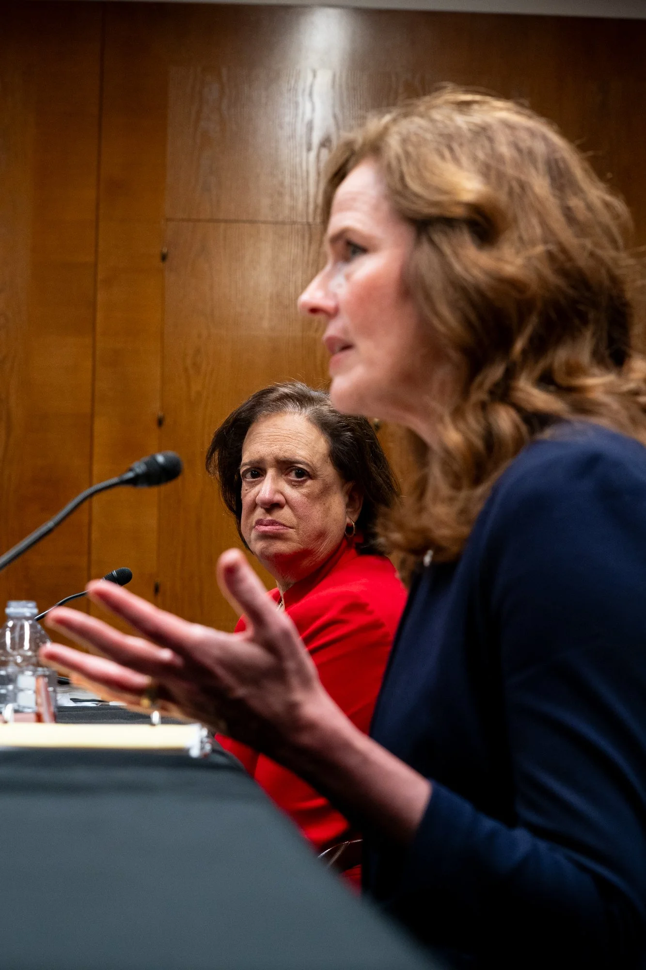 Supreme Court Justices Elena Kagan watches Justice Amy Coney Barrett answer a questions during the Senate Appropriations subcommittee hearing for the 2027 Fiscal Year budget request for the Supreme Court at the Capitol in Washington, D.C., on Monday,