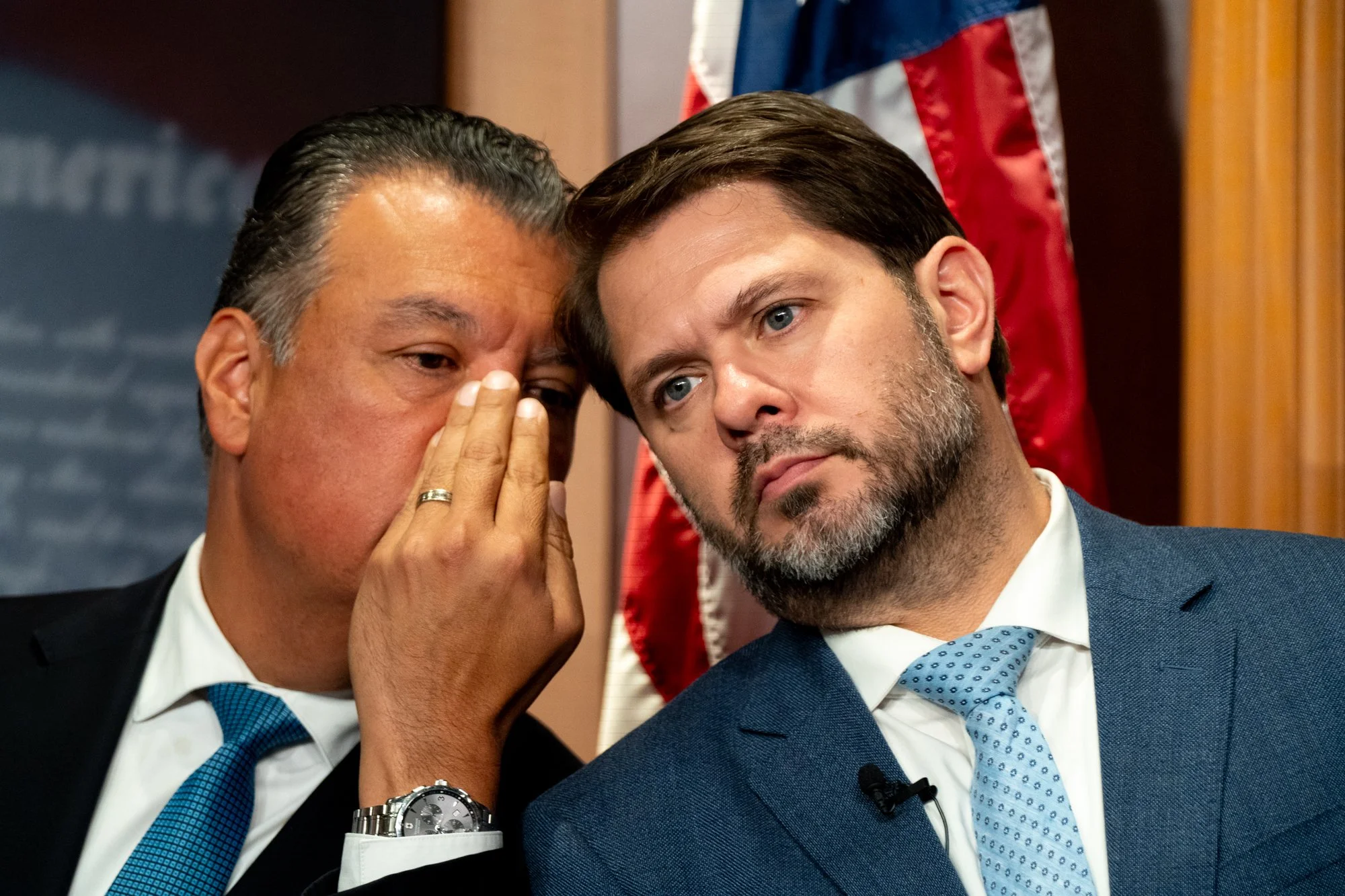 Sen. Alex Padilla (D-Calif.) and Sen Ruben Gallego (D-Ariz.) whisper during a press conference at the U.S. Capitol in Washington, D.C. on June 18, 2026.