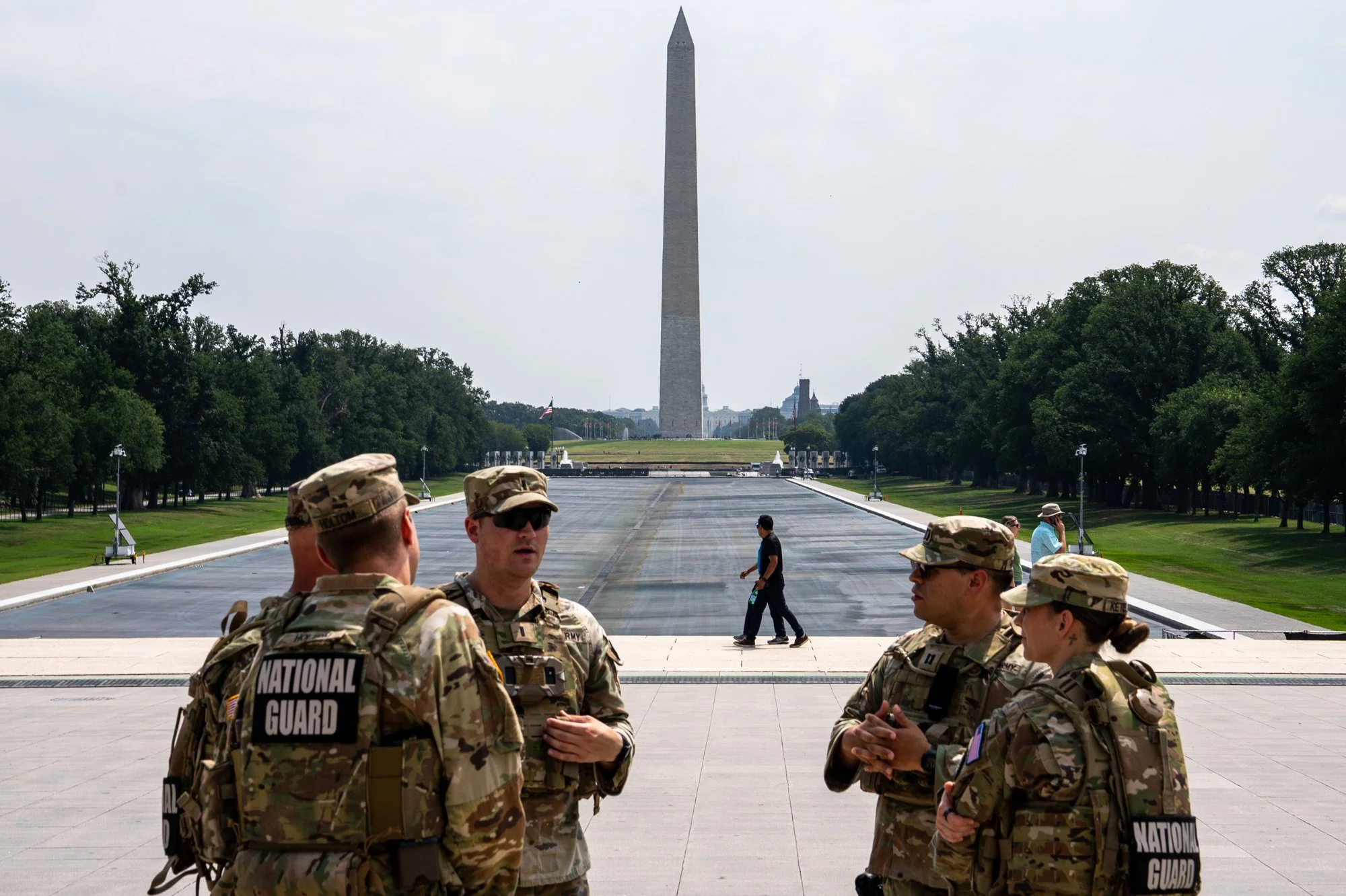 Members of the National Guard converse in front of the Reflecting Pool at the Lincoln Memorial in Washington, D.C., on Monday, July 20, 2026. (Natasha Kaiser/The Hill)