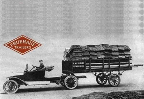 Historical image of Fruehauf NZ, depicts a black and white image of a trailer with a Fruehauf logo