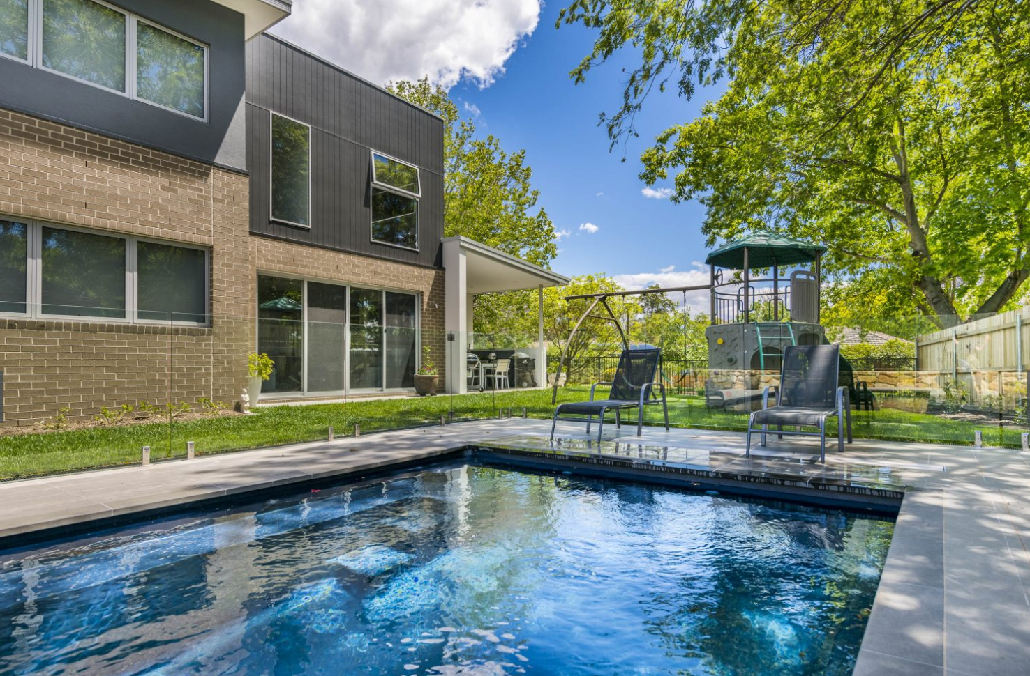 Deep blue waters of homes ingroud pool