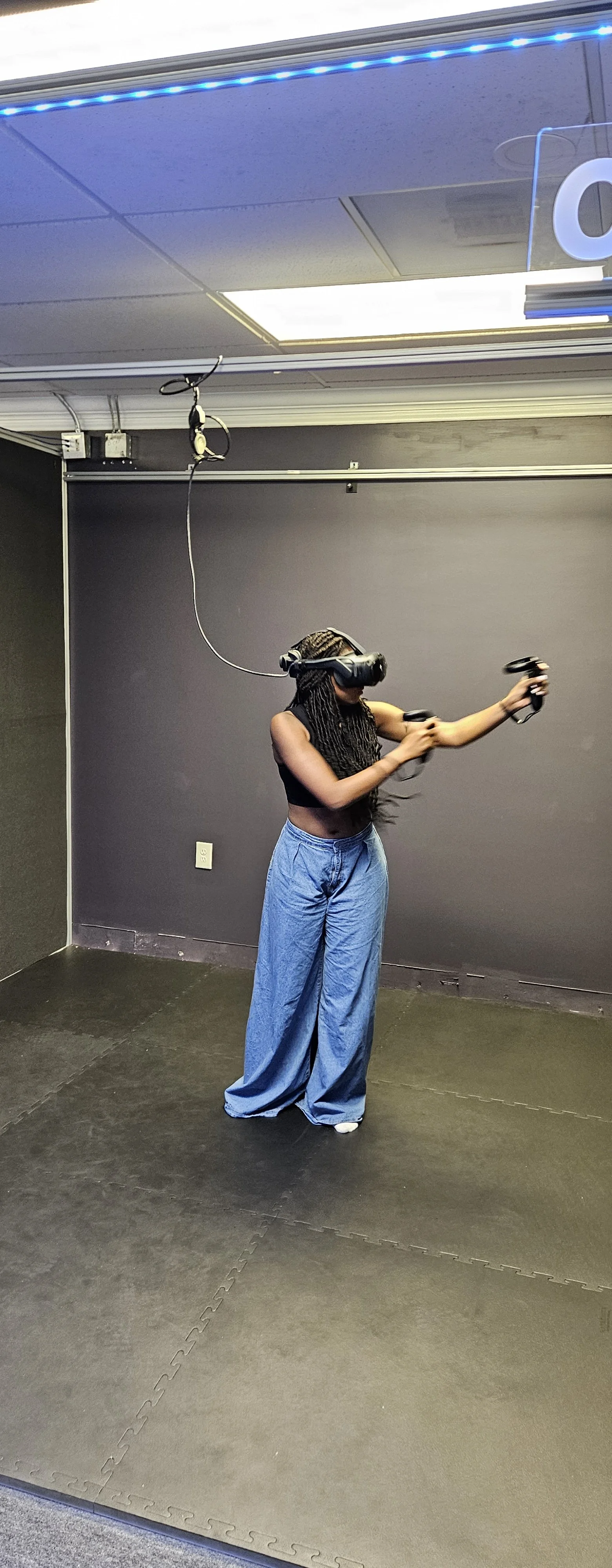 Camper in HTC Vive headset playing immersive VR
