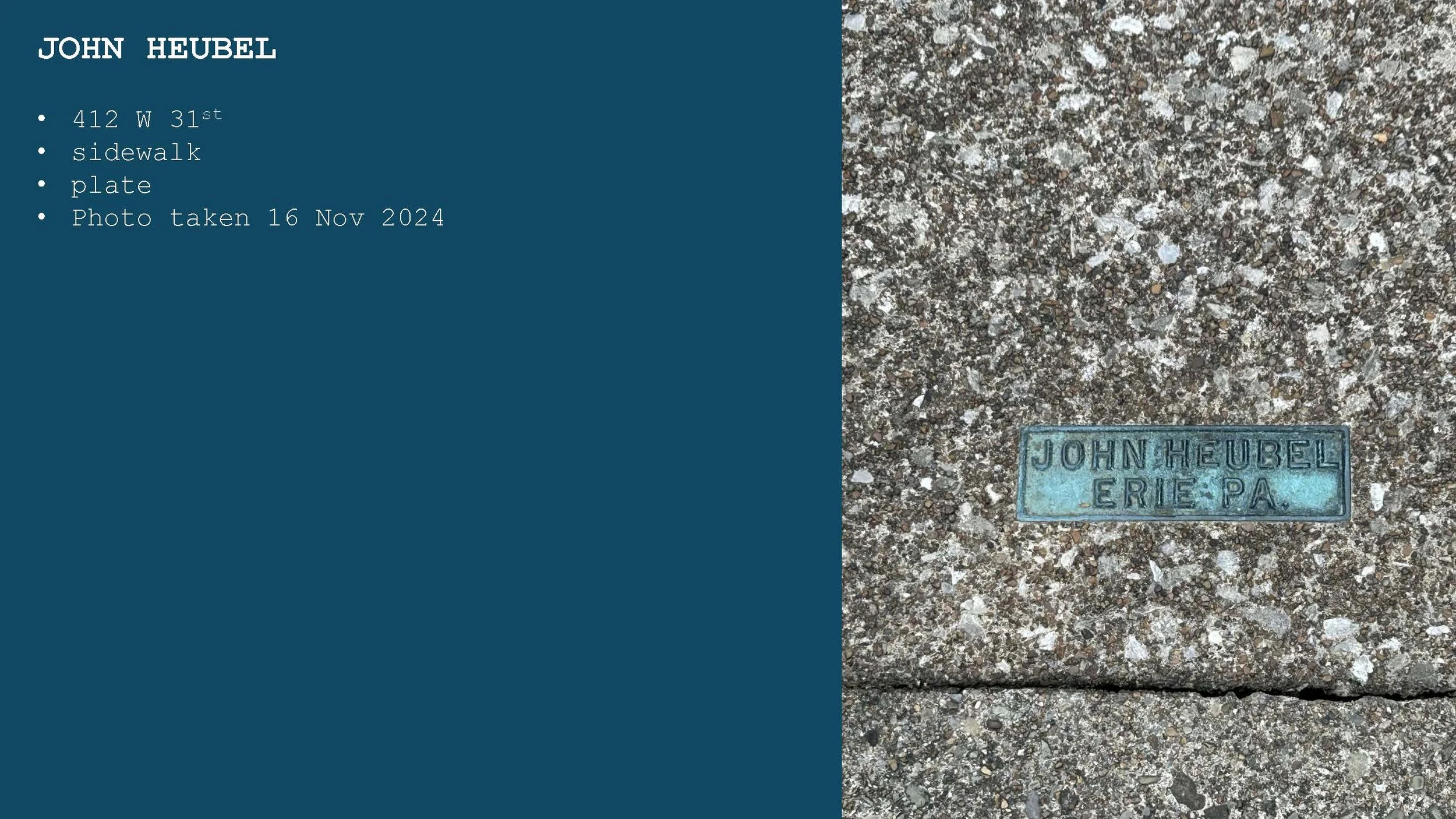 Close-up of a sidewalk with a blue metal plaque embedded that reads "JOHN HEUBEL ERIE PA."