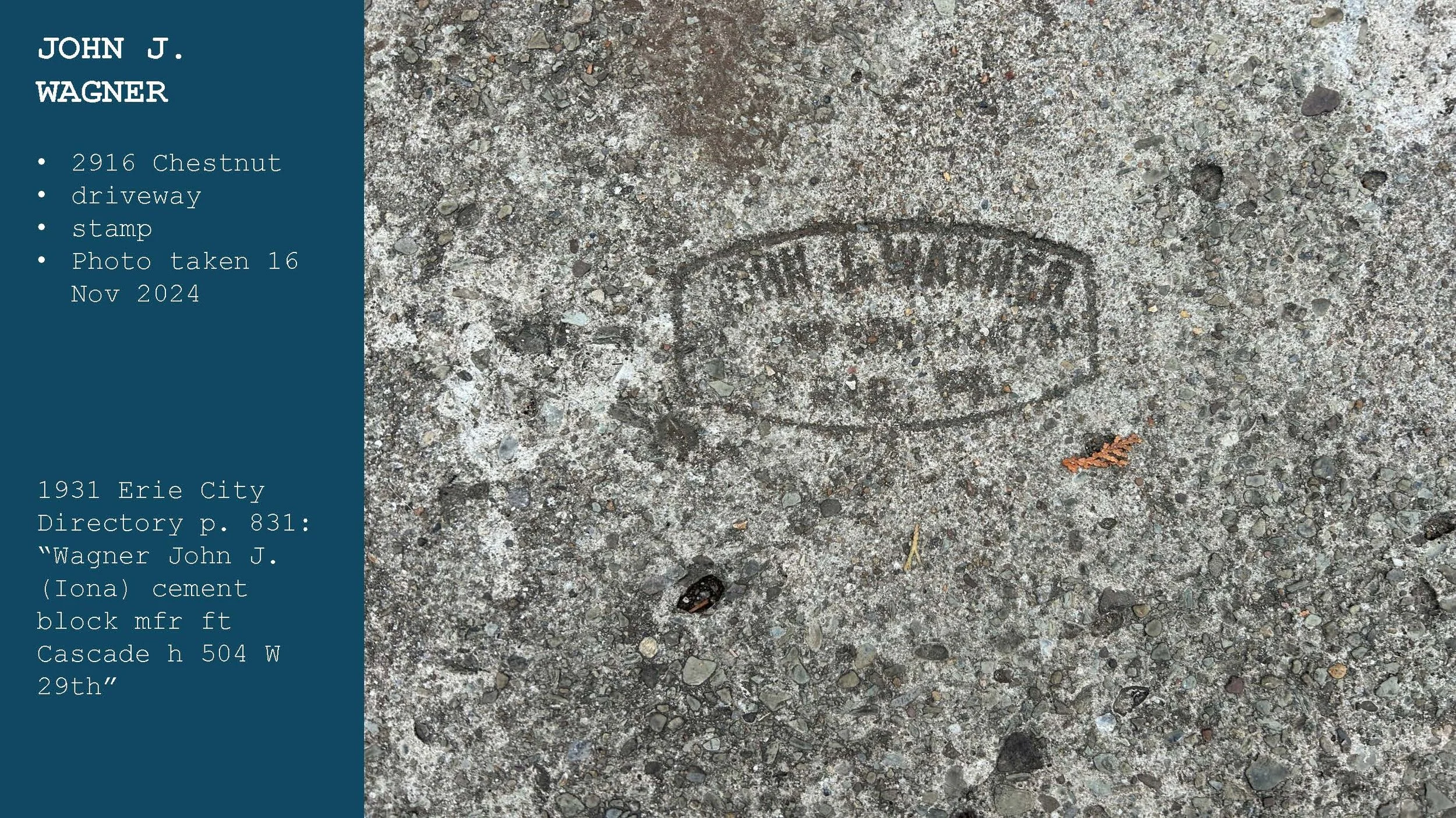 A concrete sidewalk with an embedded round metal marker or stamp. The sidewalk appears weathered with small stones and dirt around the marker.