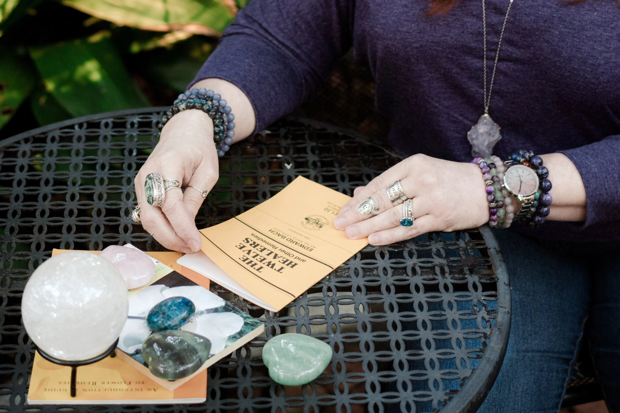 Bach Flower Remedies Coach holding a reference book.