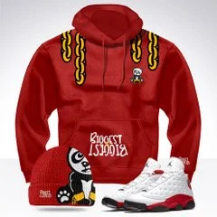 Red hoodie with black and yellow rope-like straps on the hood, small skull and crossbones logo, and the words 'Biggest Block' on the front; black socks with a white cartoon character, and white sneakers.
