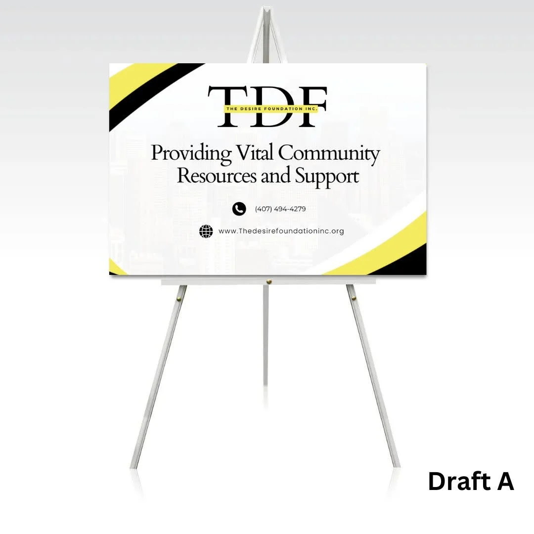 Signboard for The Desire Foundation Inc., providing community resources and support, with contact info and website, labeled 'Draft A'.