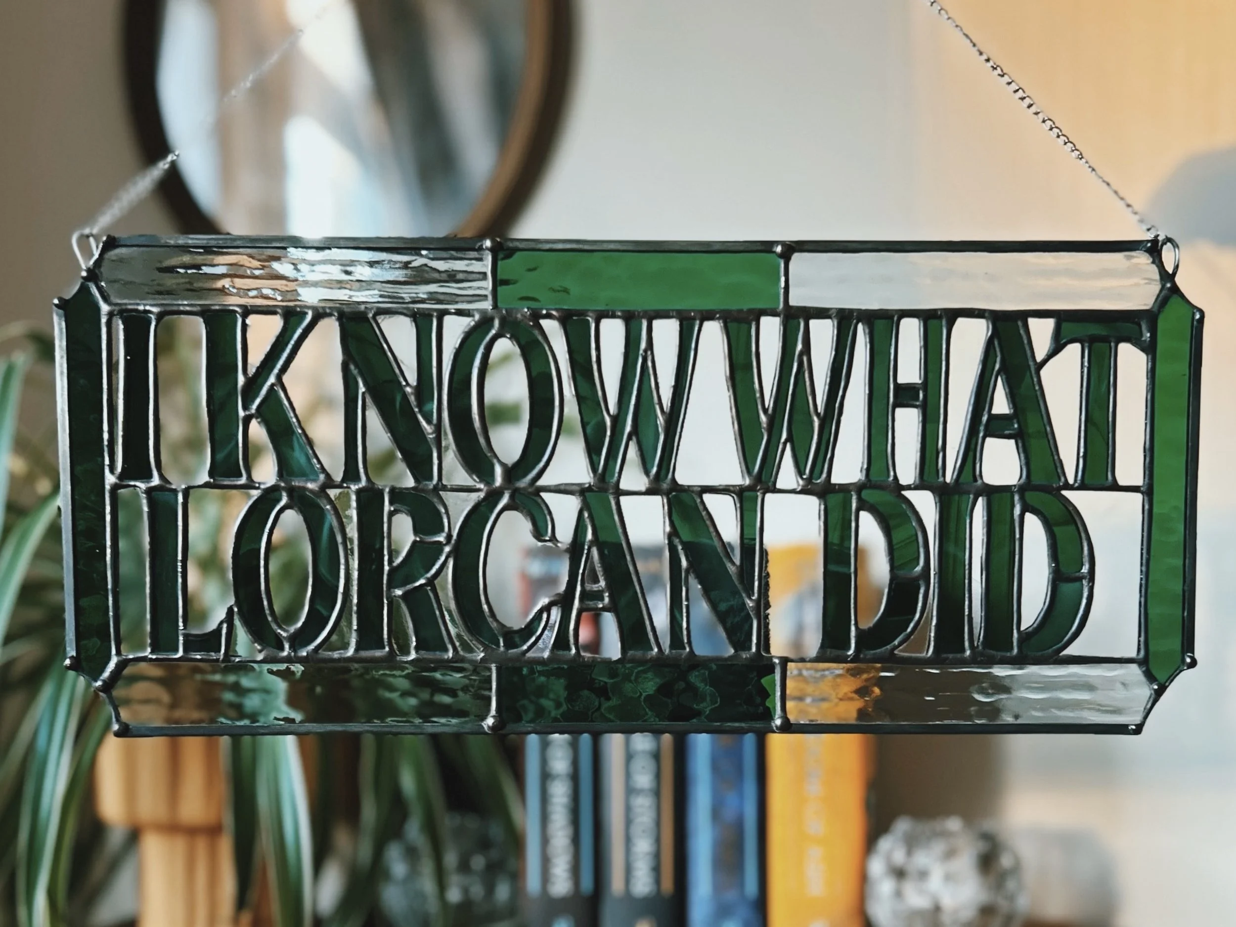 throne of glass inspired Stained glass sign that reads, "I know what loran did" with green and clear glass panels. inspired art from "what did lorcan do?"
