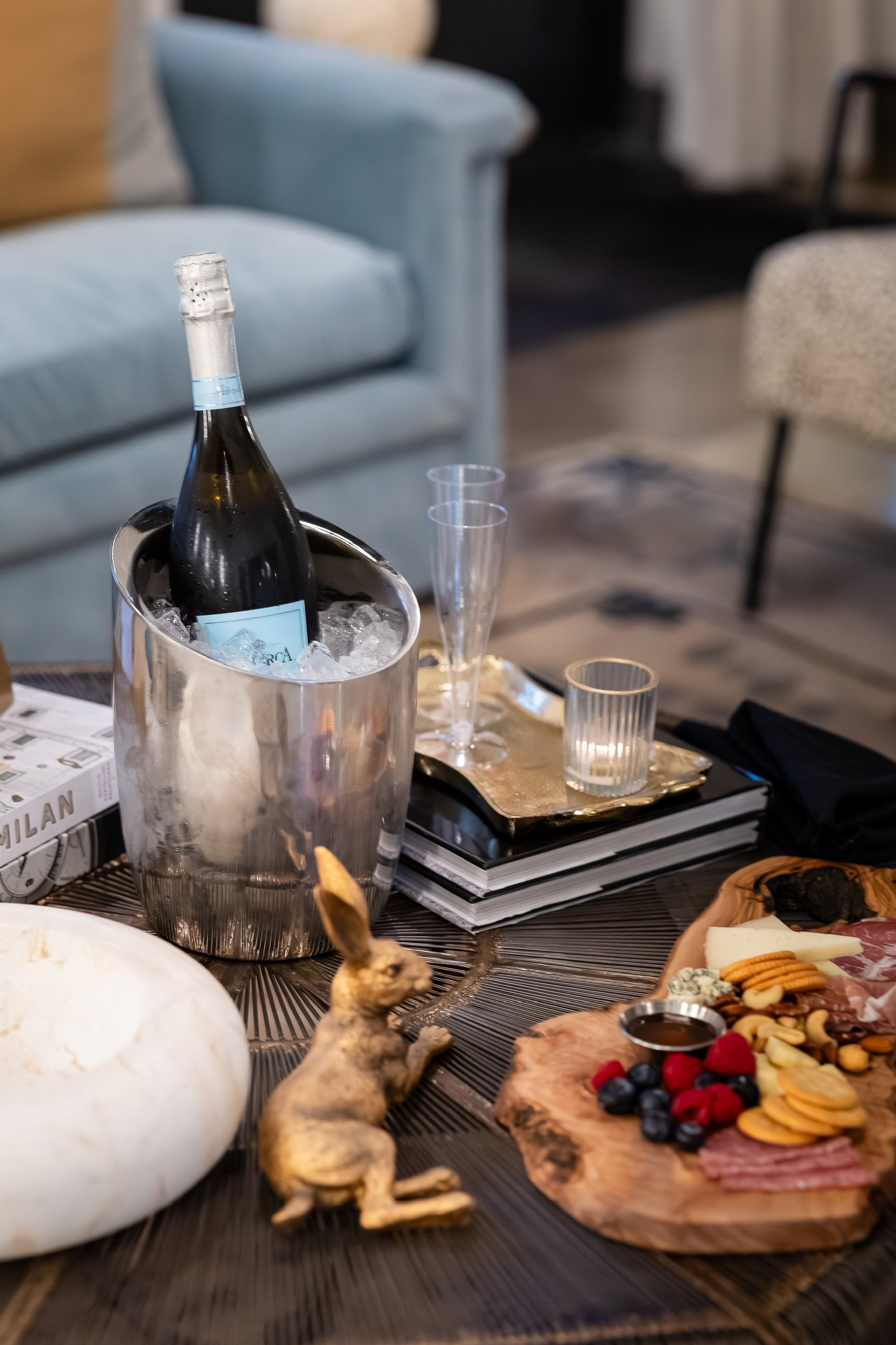 Champagne bucket and charcuterie spread at The Velveteen wedding venue in Madison, MS, set up for a private party celebration.