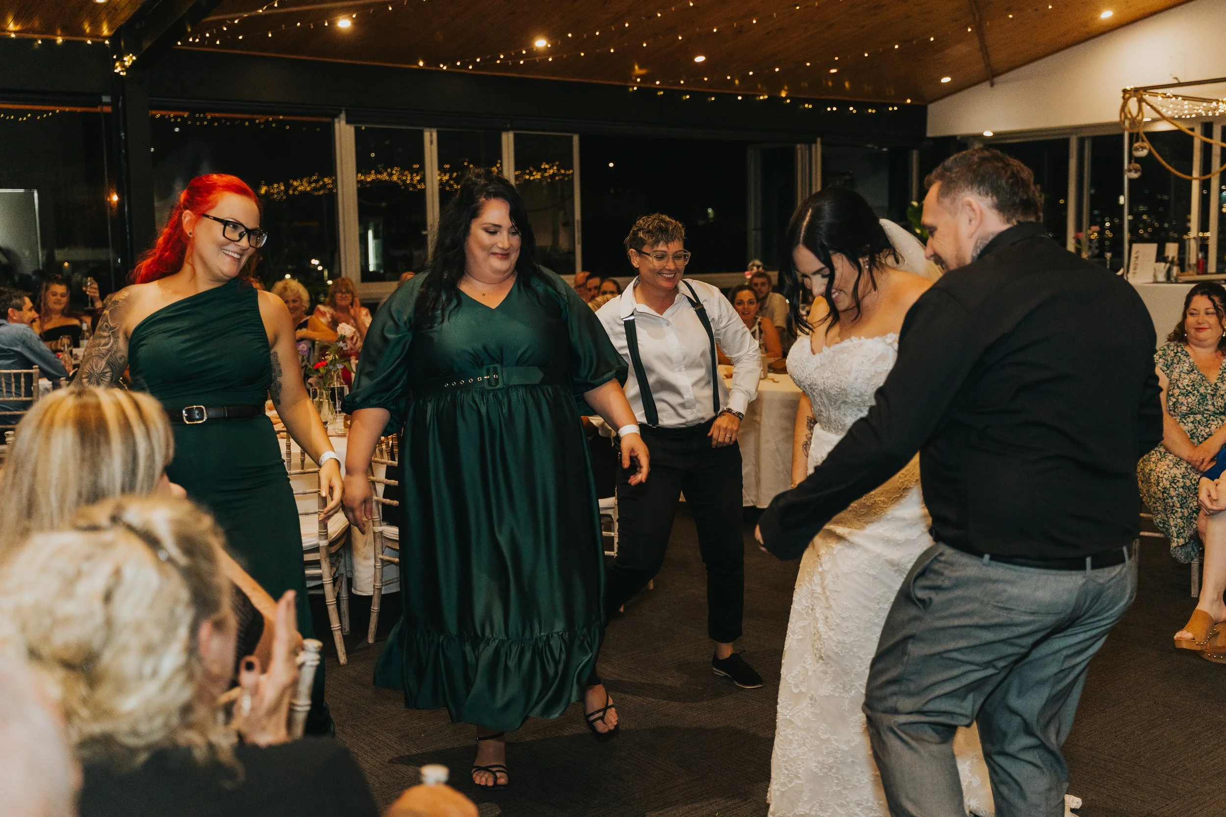 People dancing and enjoying at a wedding reception