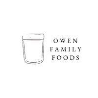 A glass of milk next to the text "Own Family Food" on a black background.