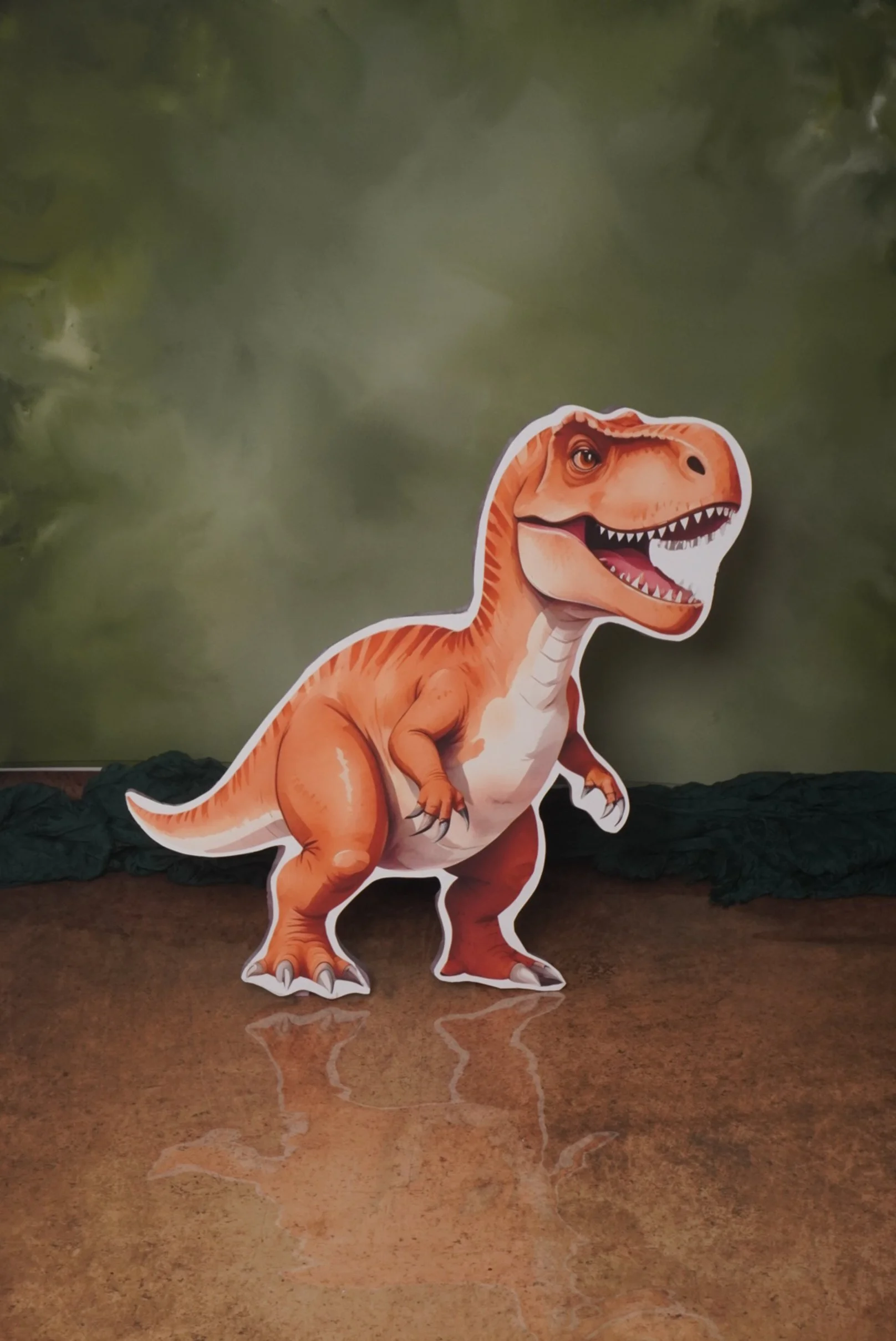 A cartoon cutout of a T-Rex dinosaur standing on a polished wooden surface with a greenish, cloudy background.