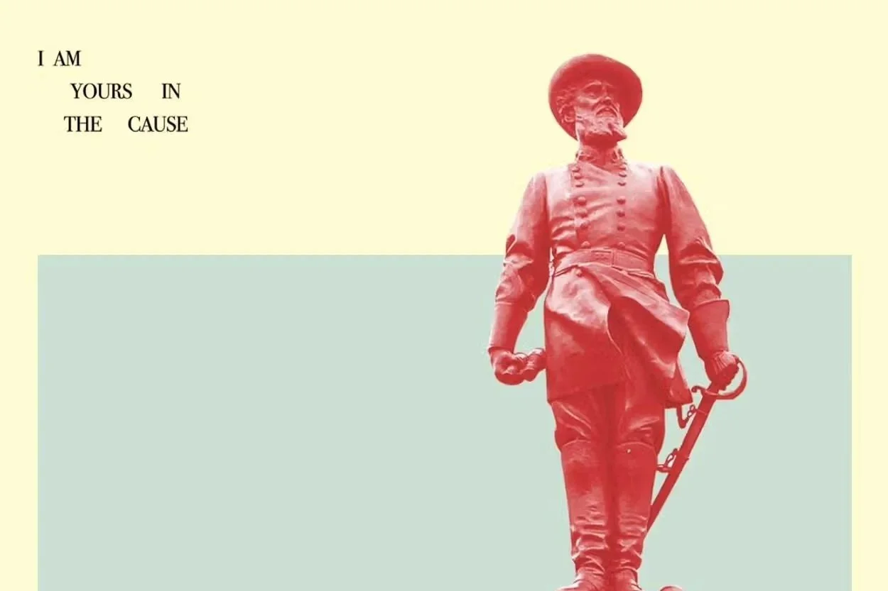 A red statue of a soldier standing with a rifle in hand, with text in the upper left corner that reads "I AM YOURS IN THE CAUSE" on a beige background.