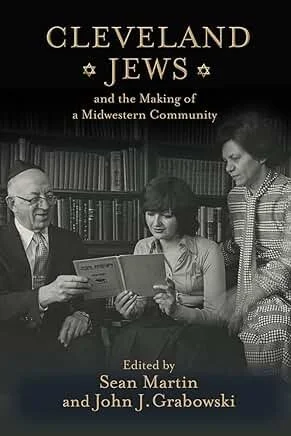 Book cover titled 'Cleveland Jews and the Making of a Midwestern Community,' edited by Sean Martin and John J. Grabowski, featuring a black-and-white photo of three people reading a book together in a library.