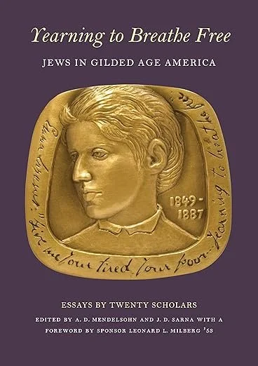 Book cover titled 'Learning to Breathe Free: Jews in Gilded Age America,' featuring a gold medal with a profile of a young person, and the years 1949 and 1887 engraved on it.