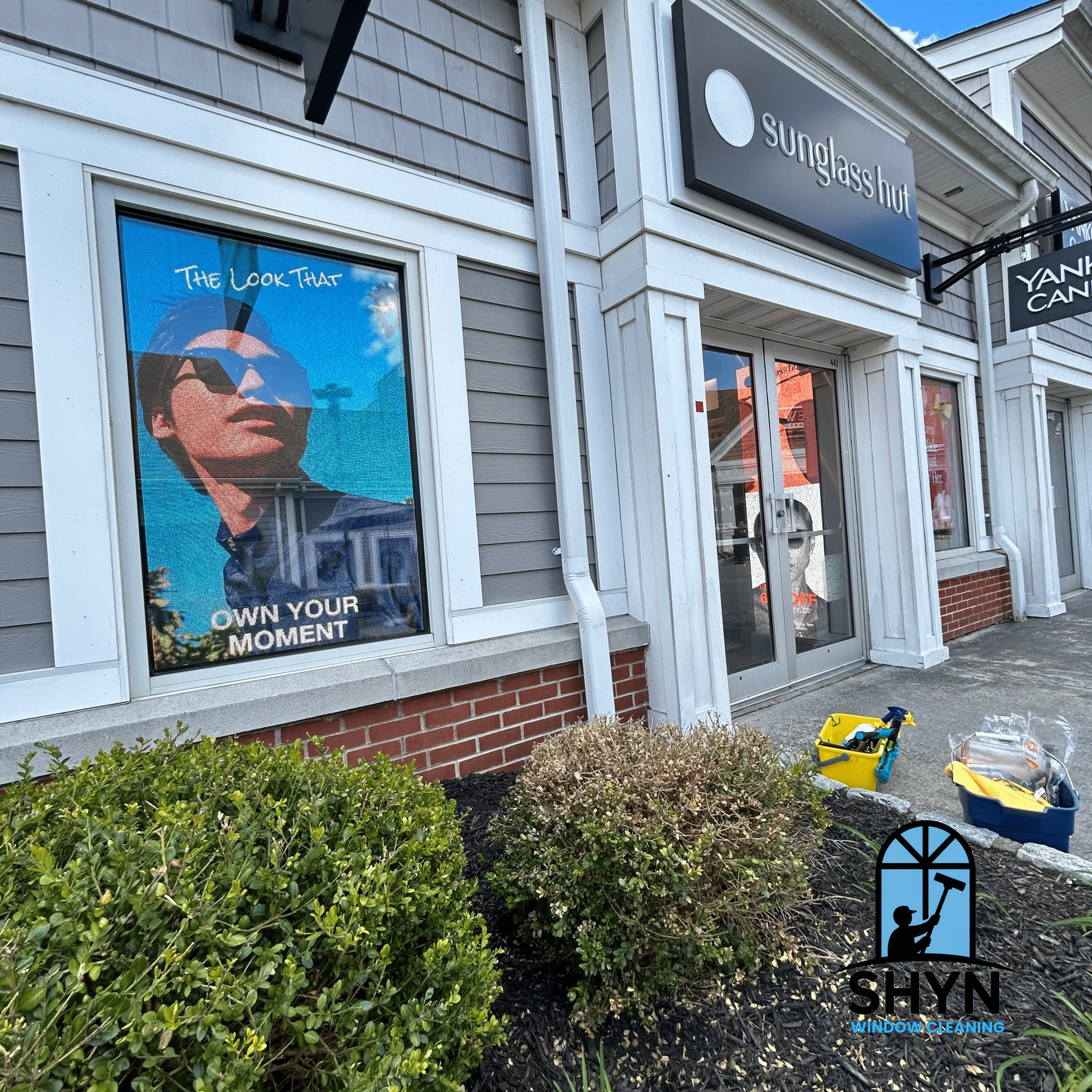Premium interior and exterior window cleaning performed by SHYN Window Cleaning on a commercial store front windows.