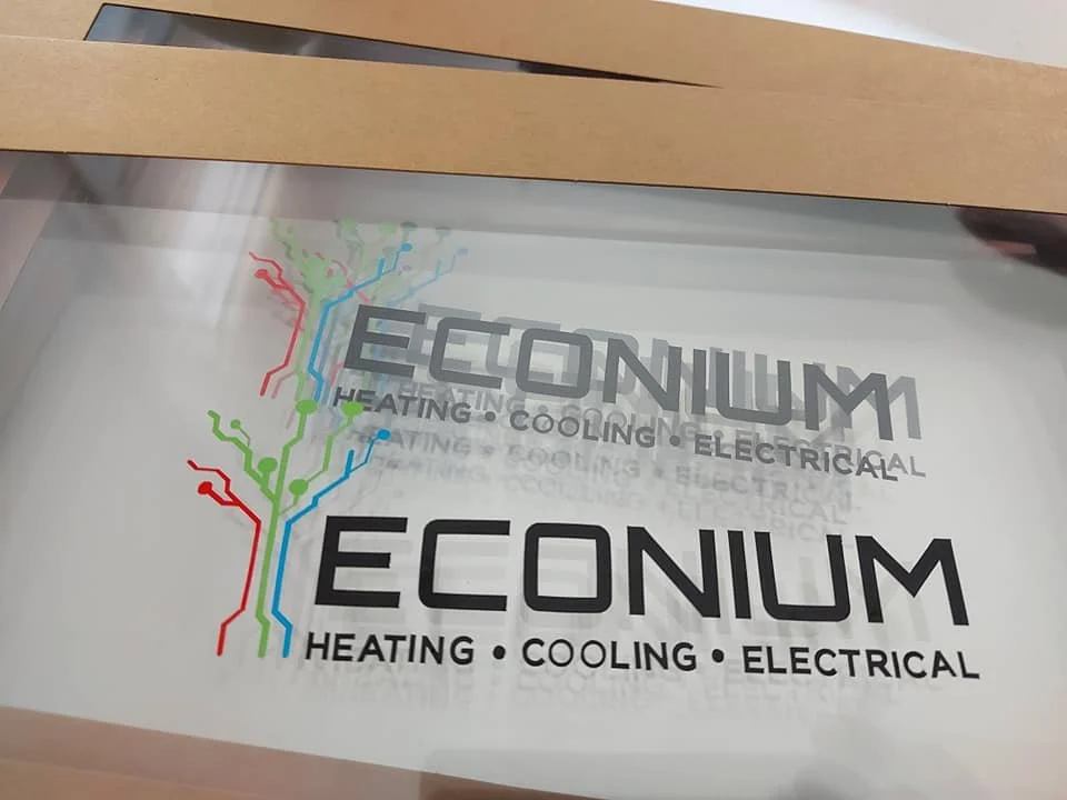 Econium logo with text 'Heating, Cooling, Electrical' and a stylized color-coded electrical circuit diagram.