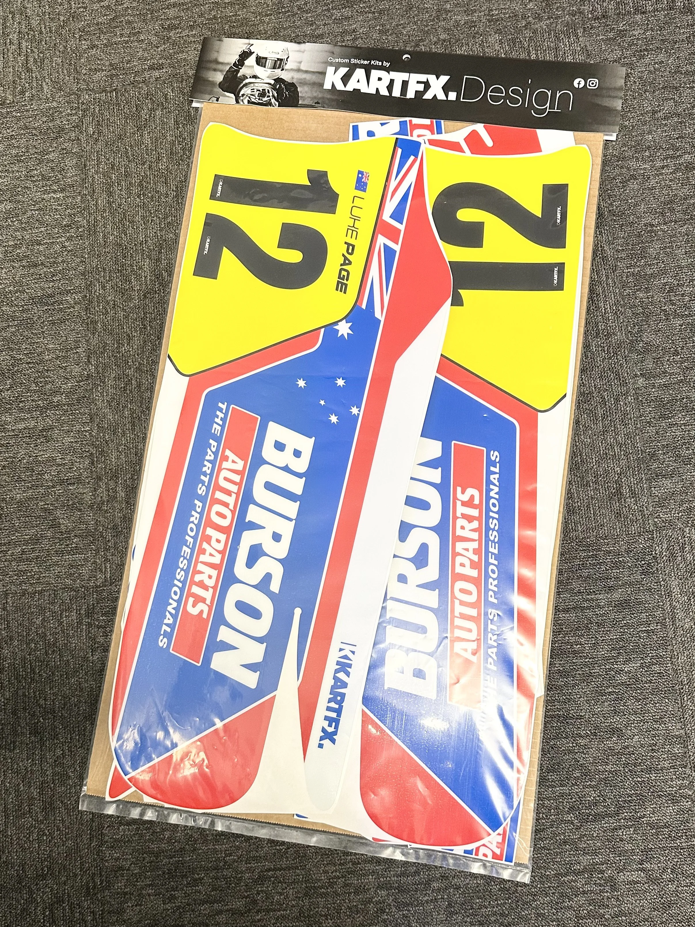 Collection of KartFX sticker sheets for race car decals, featuring numbers, flags, and automotive branding.
