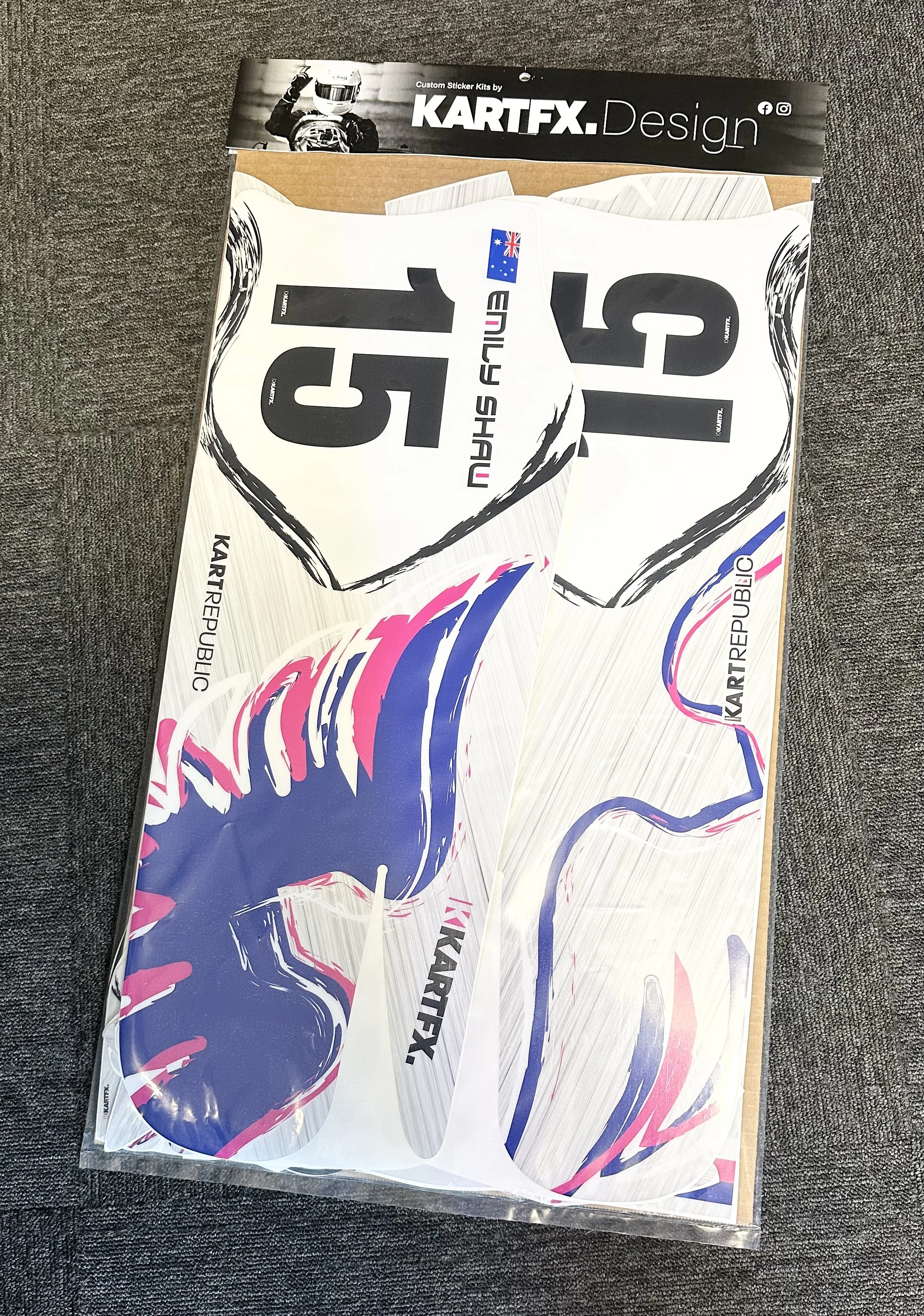 A sheet of racing stickers featuring a predominantly blue wolf head with pink and white accents, the number 151 in black, and branding for Kartfx Design and KARTREPUBLIC.