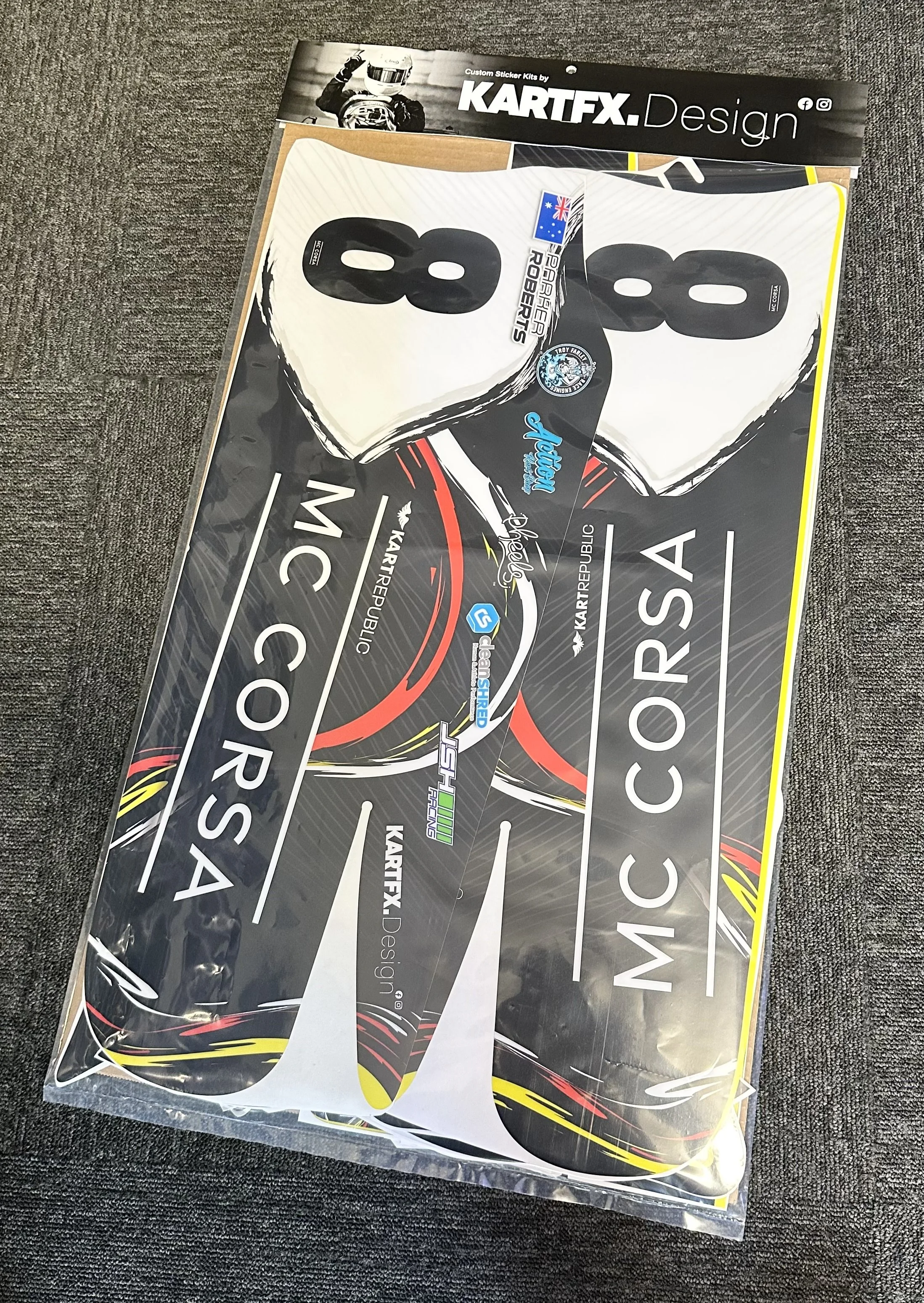 A set of custom motorcycle stickers in a plastic packaging. The stickers feature the number 88, a motorcycle helmet image, and various logos and text.