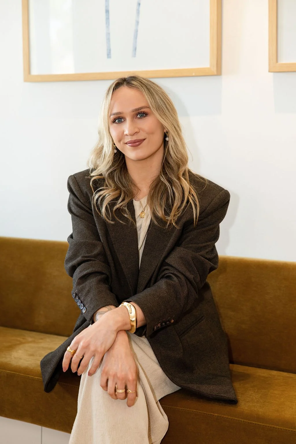 A professional, warm Naturopath sitting in her East Fremantle Clinic