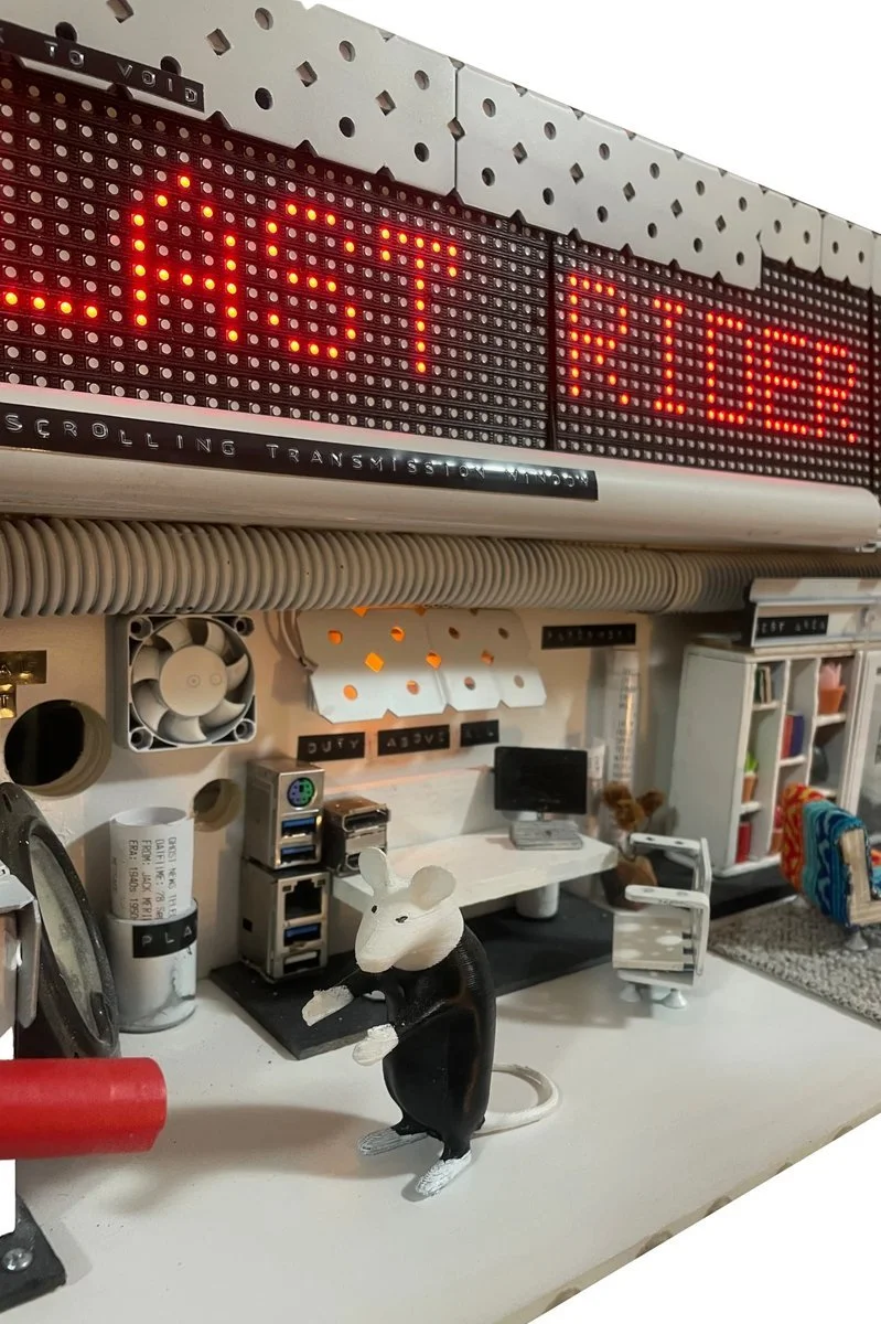 Mouse collecting printouts. The homunculus compiling fragmentations.