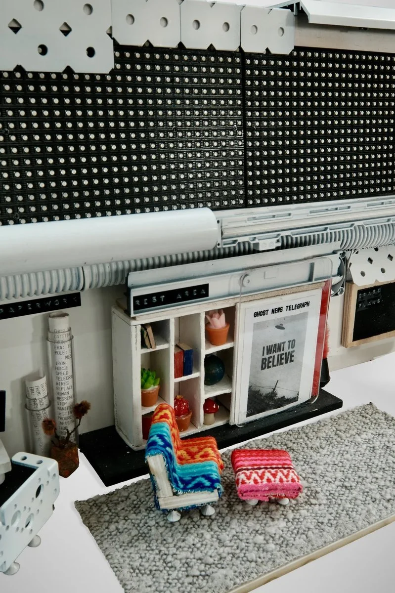 The diorama IS my house. Built my workspace in miniature without knowing.