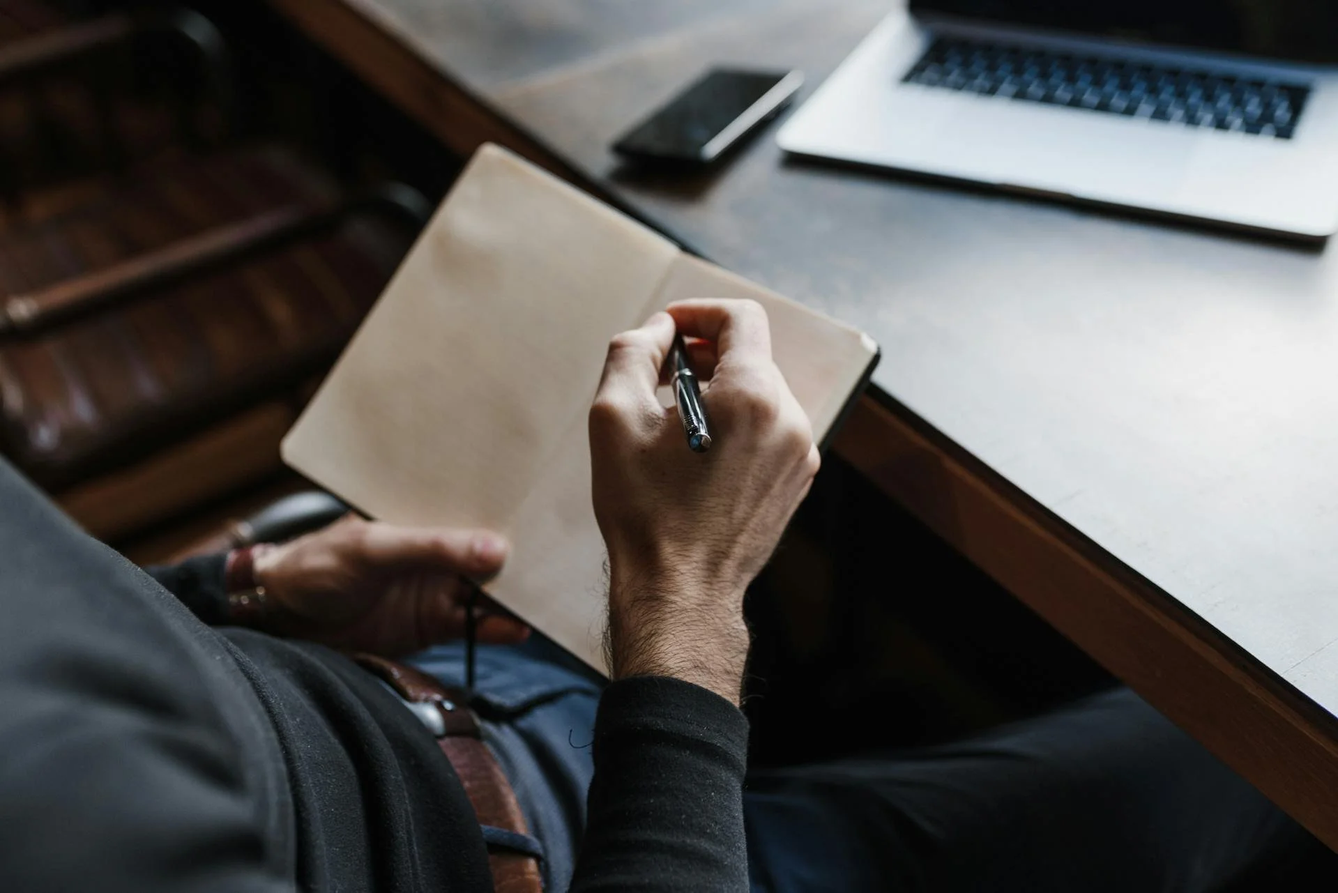 A doctor taking notes during an adult ADHD assessment for men on vancouver island at Victoria Men's Health Clinic.