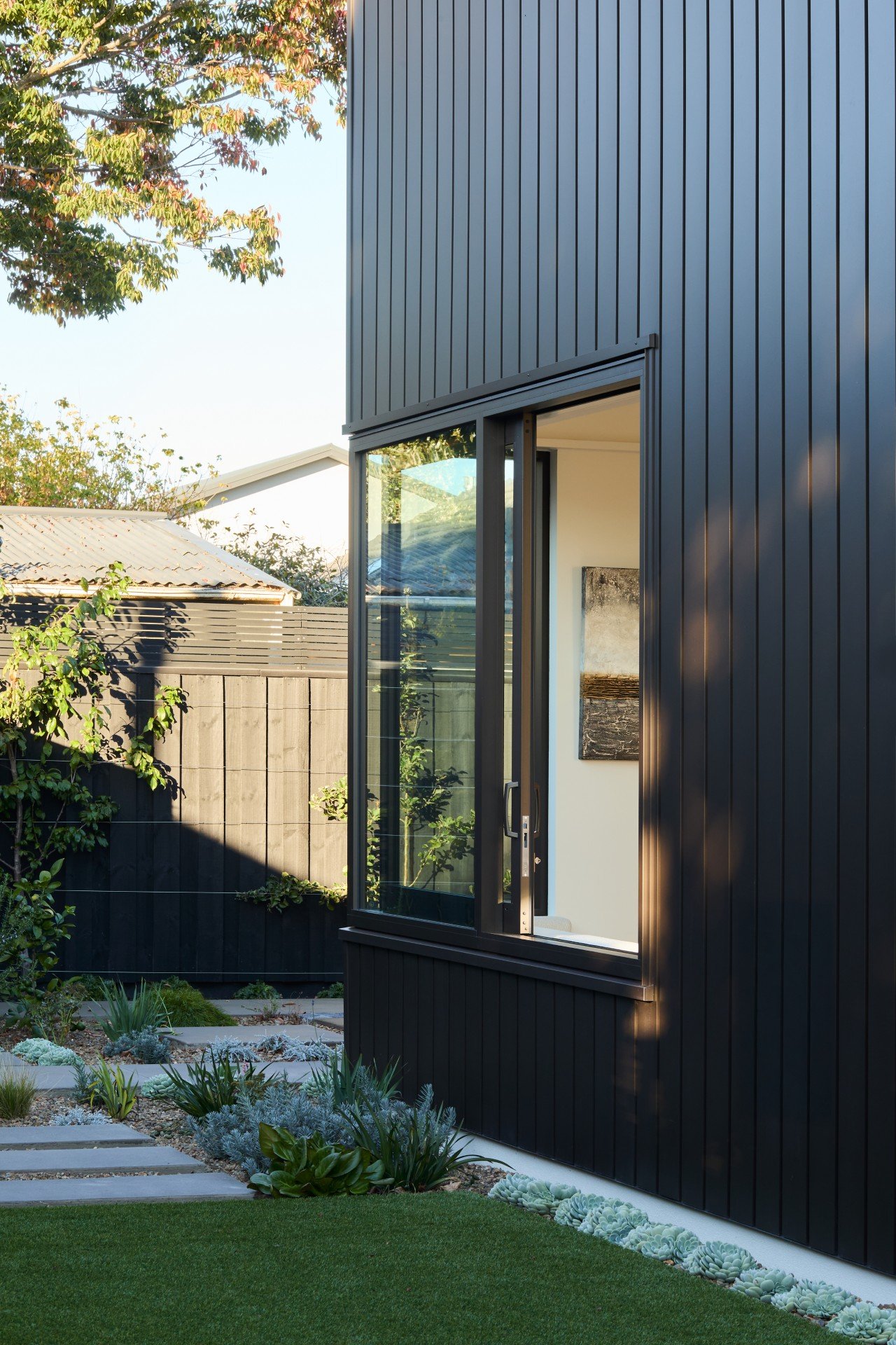 Precision-engineered Flashman and custom aluminium flashings integrated into a building façade for seamless cladding and weather protection.