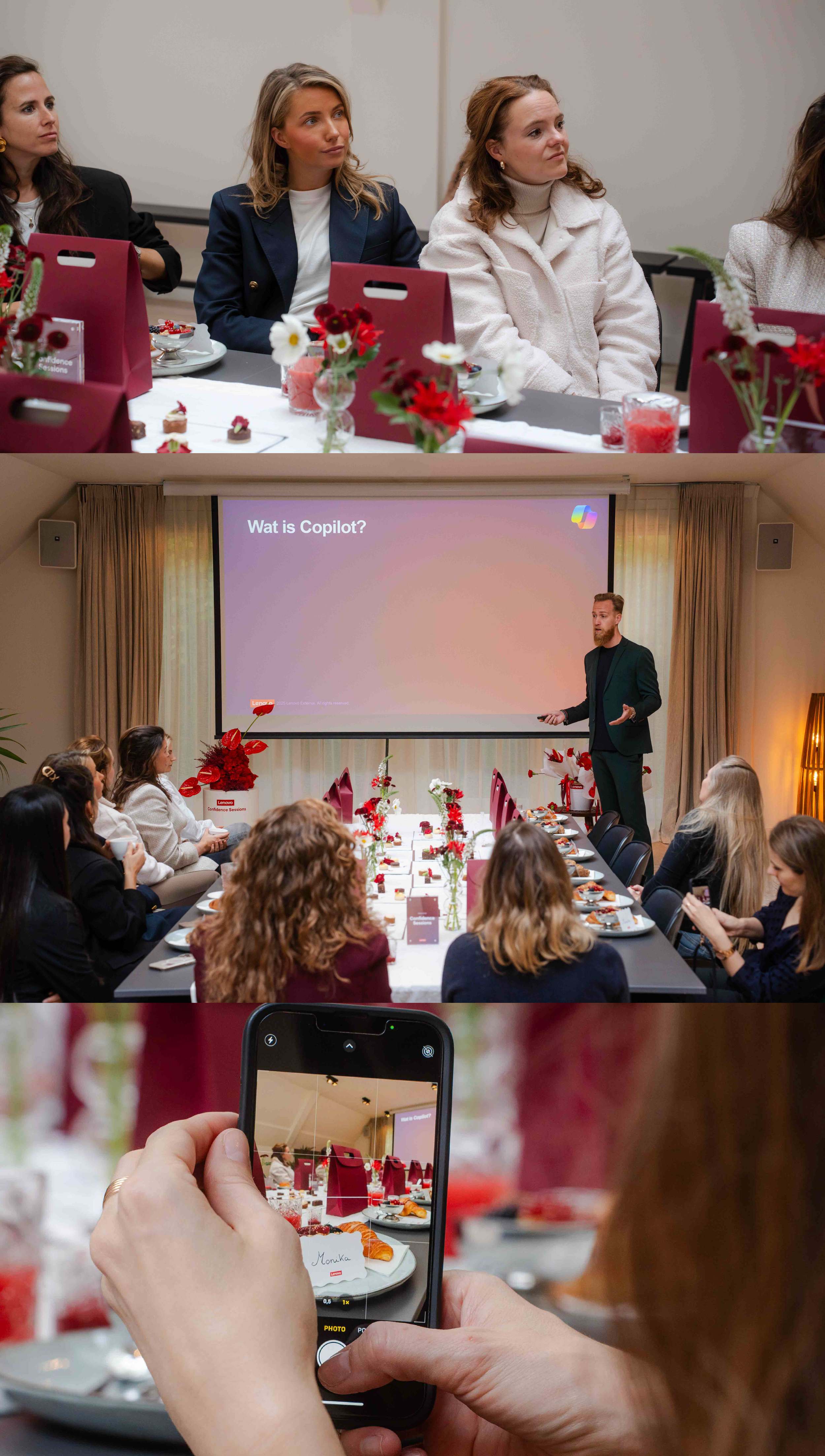People attending a presentation in a conference room, a woman taking a photo of the table with a smartphone, decorated with red and white flowers, gift bags, and plates of food.