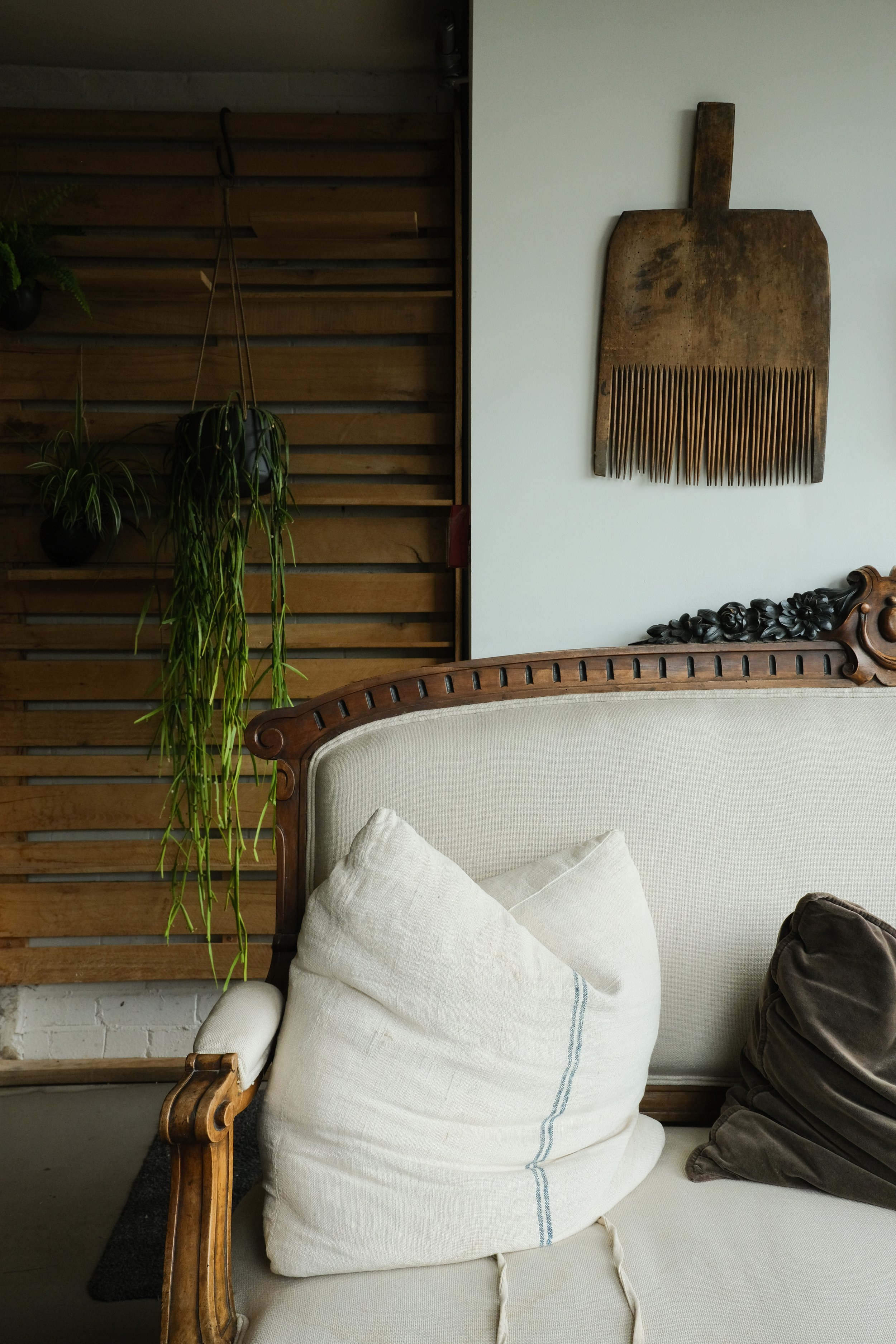 An antique sofa with neutral walls in The Beacon country house 